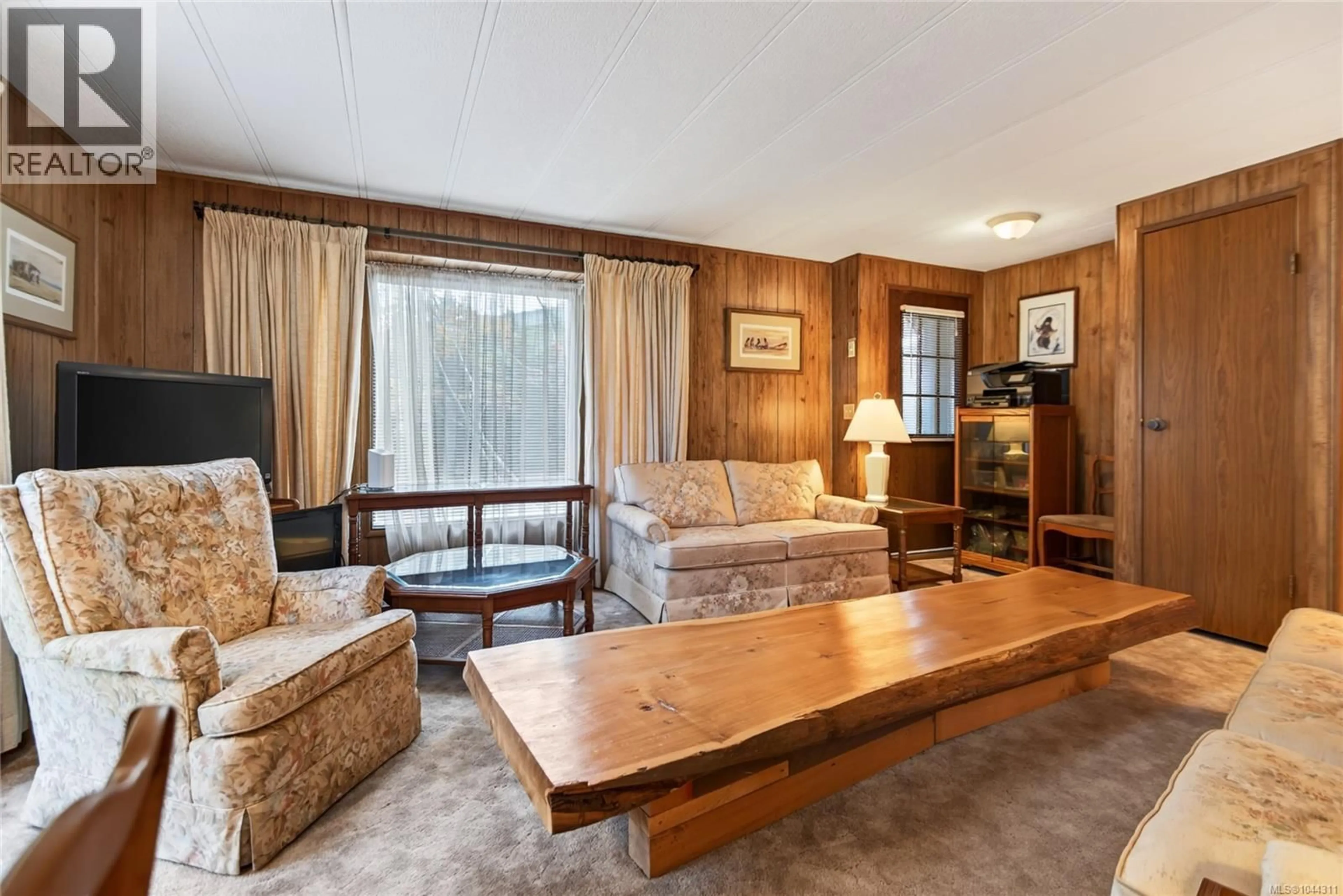 Living room with furniture, wood/laminate floor for 1791 ASTRA ROAD, Comox British Columbia V9M4B6