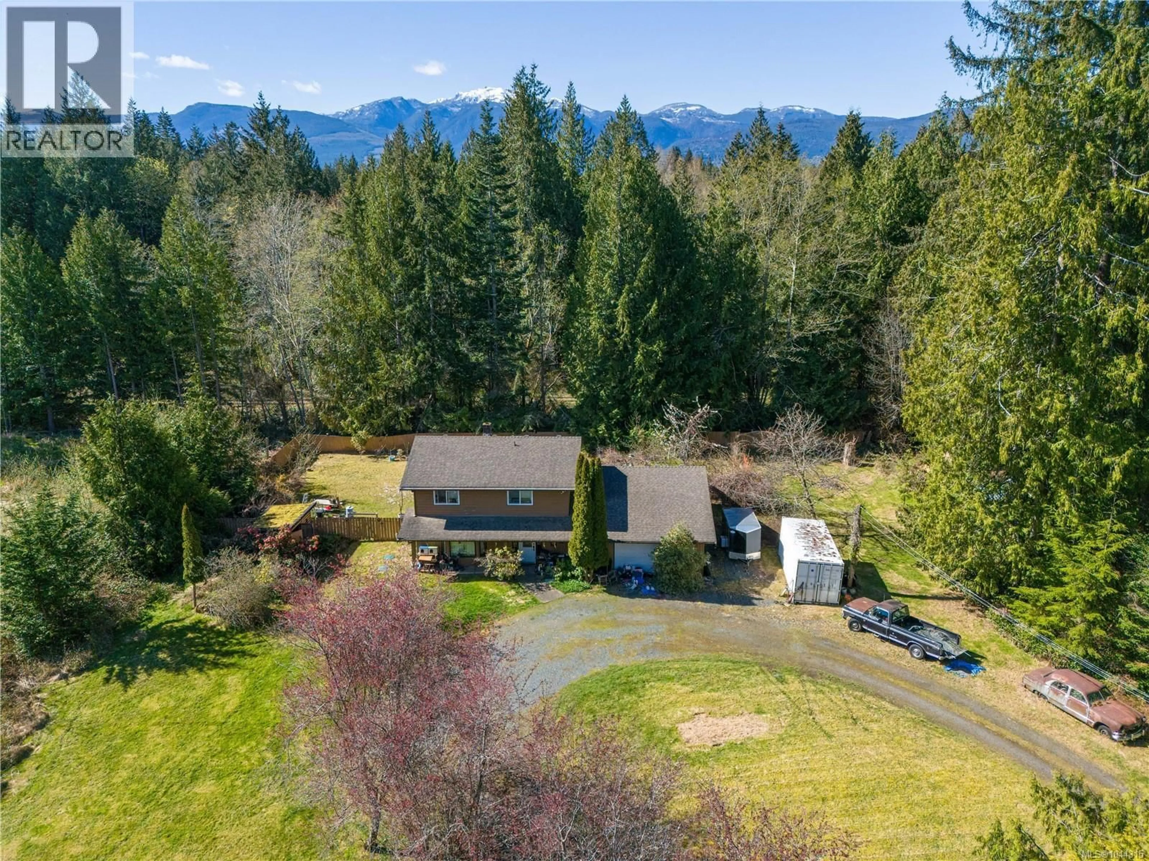 A pic from outside/outdoor area/front of a property/back of a property/a pic from drone, mountain view for 4080 ISLAND HIGHWAY, Qualicum Beach British Columbia V9K2B1