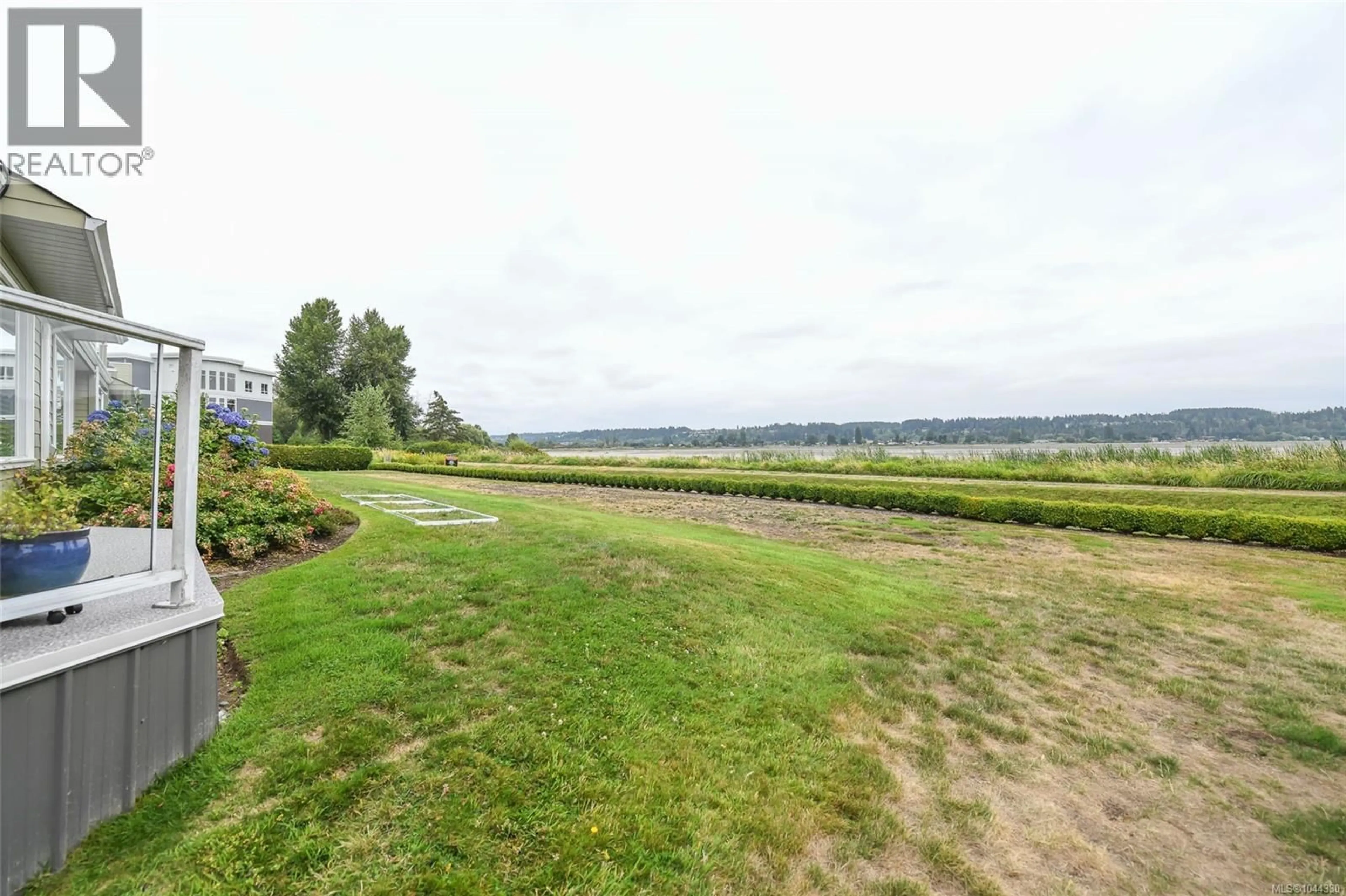 A pic from outside/outdoor area/front of a property/back of a property/a pic from drone, water/lake/river/ocean view for 104 - 2970 CLIFFE AVENUE, Courtenay British Columbia V9N2L7