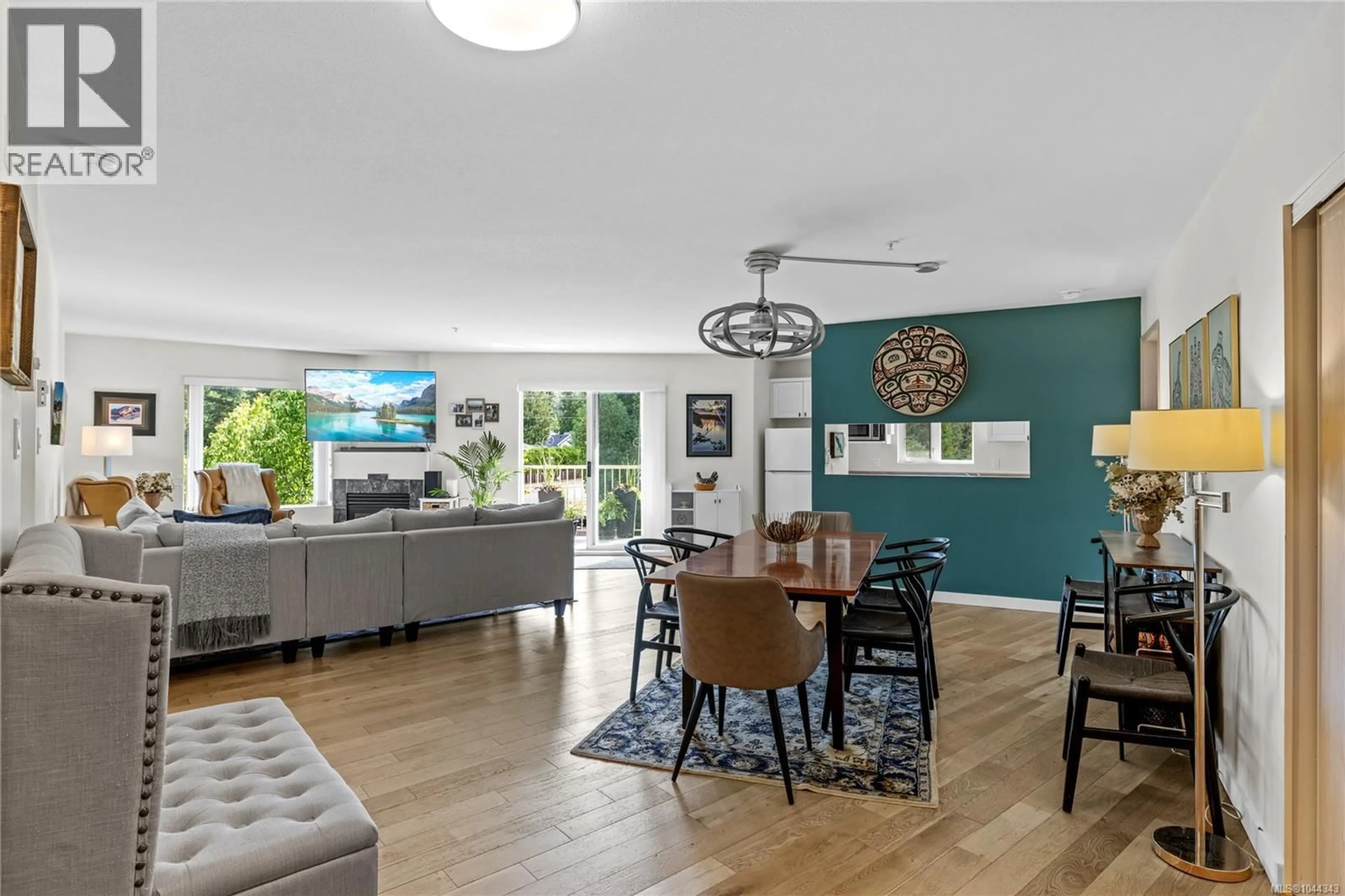 Open concept kitchen, wood/laminate floor for 409 - 4971 SONGBIRD PLACE, Nanaimo British Columbia V9T6L1