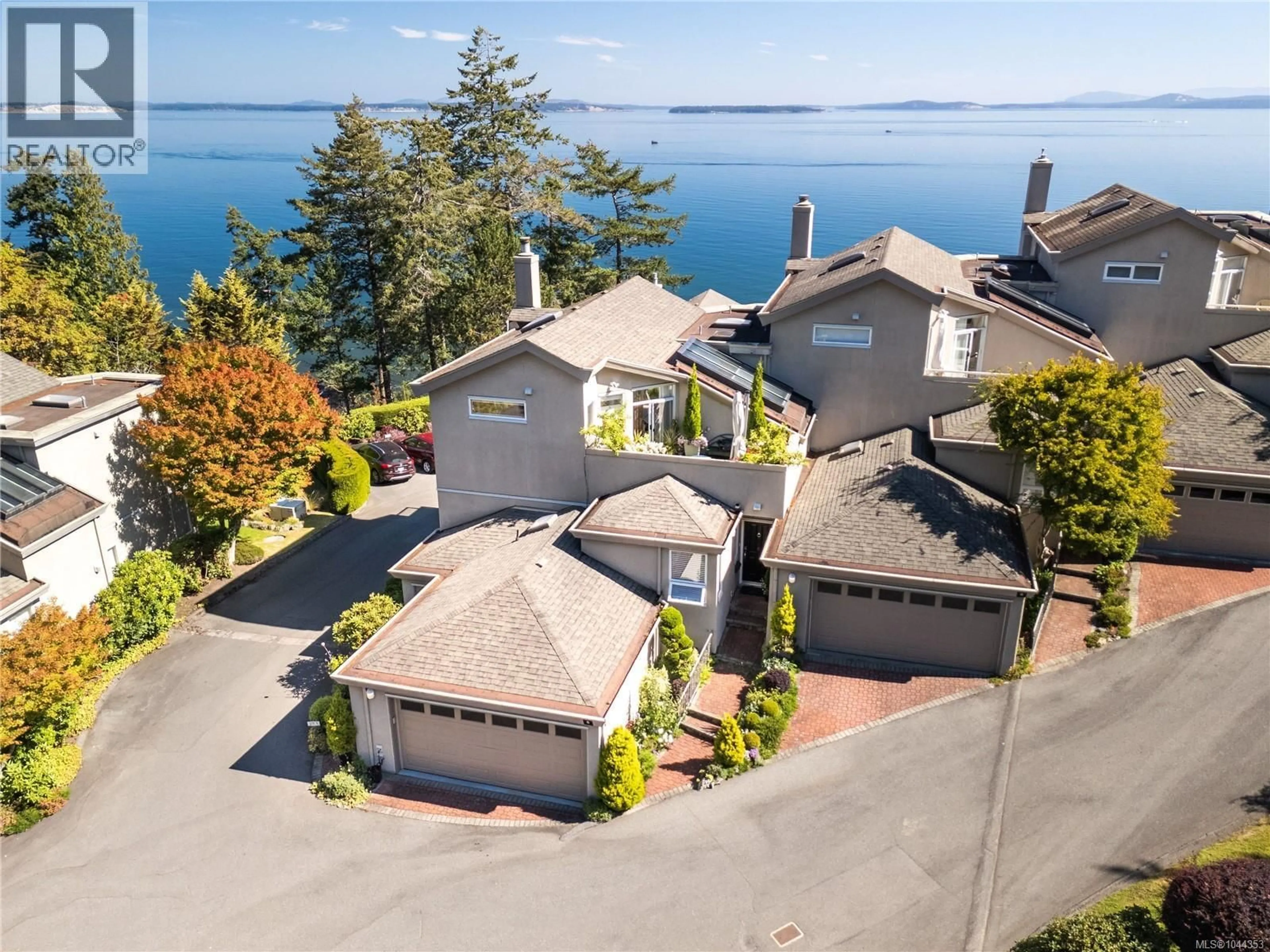 A pic from outside/outdoor area/front of a property/back of a property/a pic from drone, water/lake/river/ocean view for 5 - 4771 CORDOVA BAY ROAD, Saanich British Columbia V8Y2J7