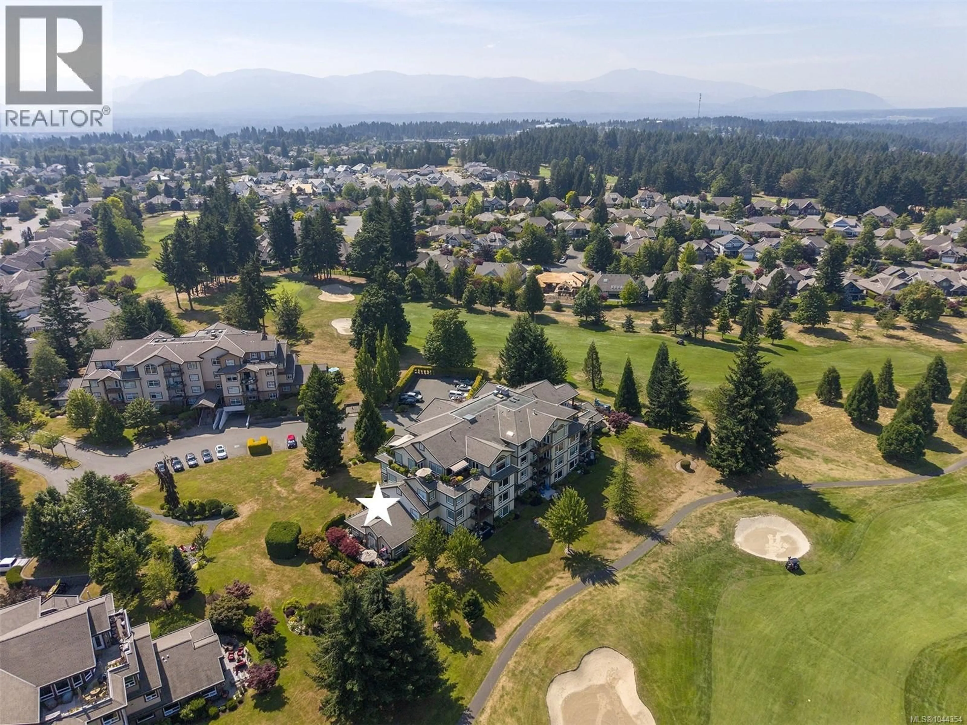 A pic from outside/outdoor area/front of a property/back of a property/a pic from drone, mountain view for 216 - 3666 ROYAL VISTA WAY, Courtenay British Columbia V9N9X8
