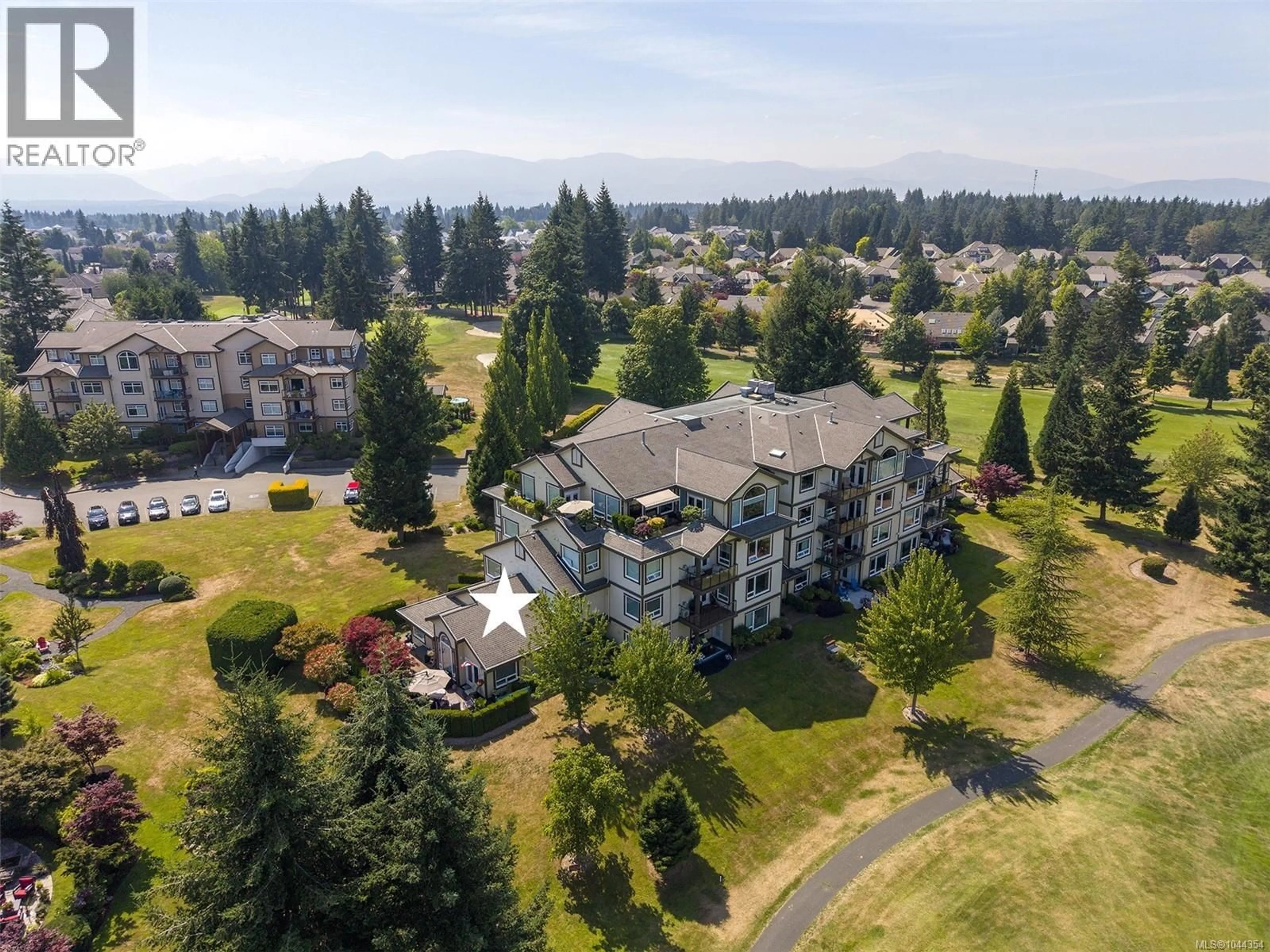 A pic from outside/outdoor area/front of a property/back of a property/a pic from drone, unknown for 216 - 3666 ROYAL VISTA WAY, Courtenay British Columbia V9N9X8