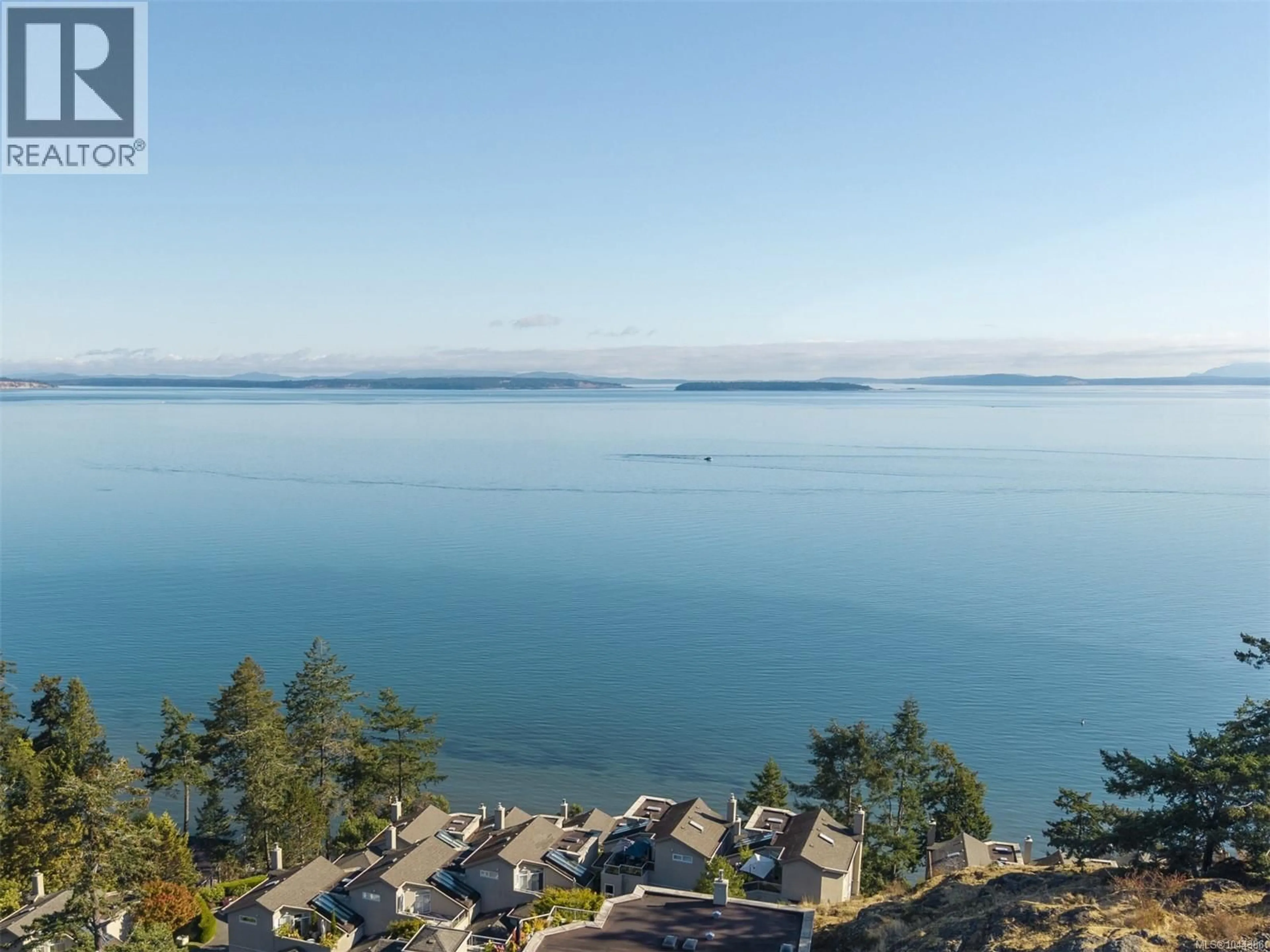 A pic from outside/outdoor area/front of a property/back of a property/a pic from drone, water/lake/river/ocean view for 1 - 4771 CORDOVA BAY ROAD, Saanich British Columbia V8Y2J7