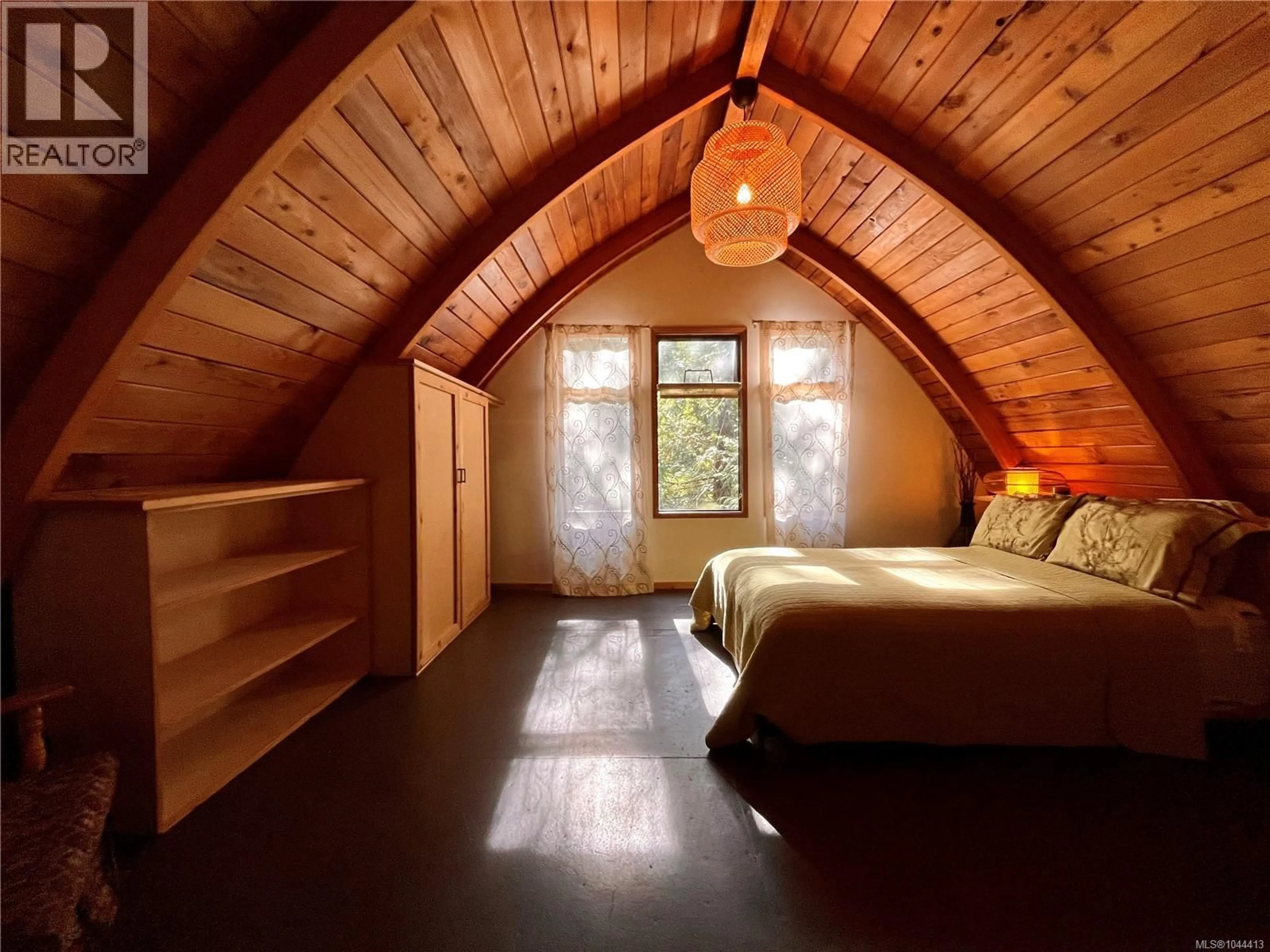 Bedroom with bed, wood/laminate floor for 387 LYNGAIL PLACE, Gabriola Island British Columbia V0R1X1