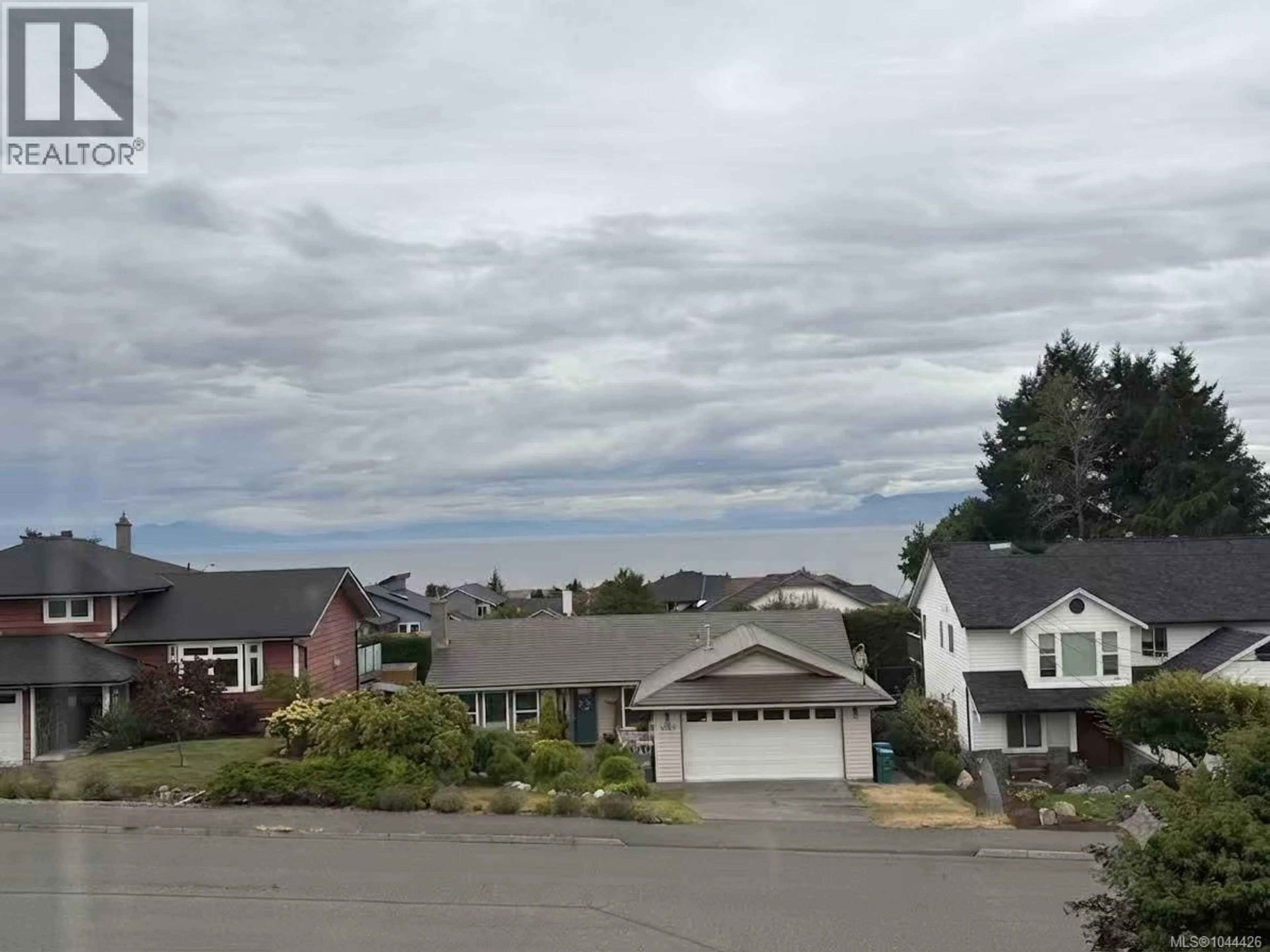 A pic from outside/outdoor area/front of a property/back of a property/a pic from drone, mountain view for 6063 WALDBANK ROAD, Nanaimo British Columbia V9V1C7