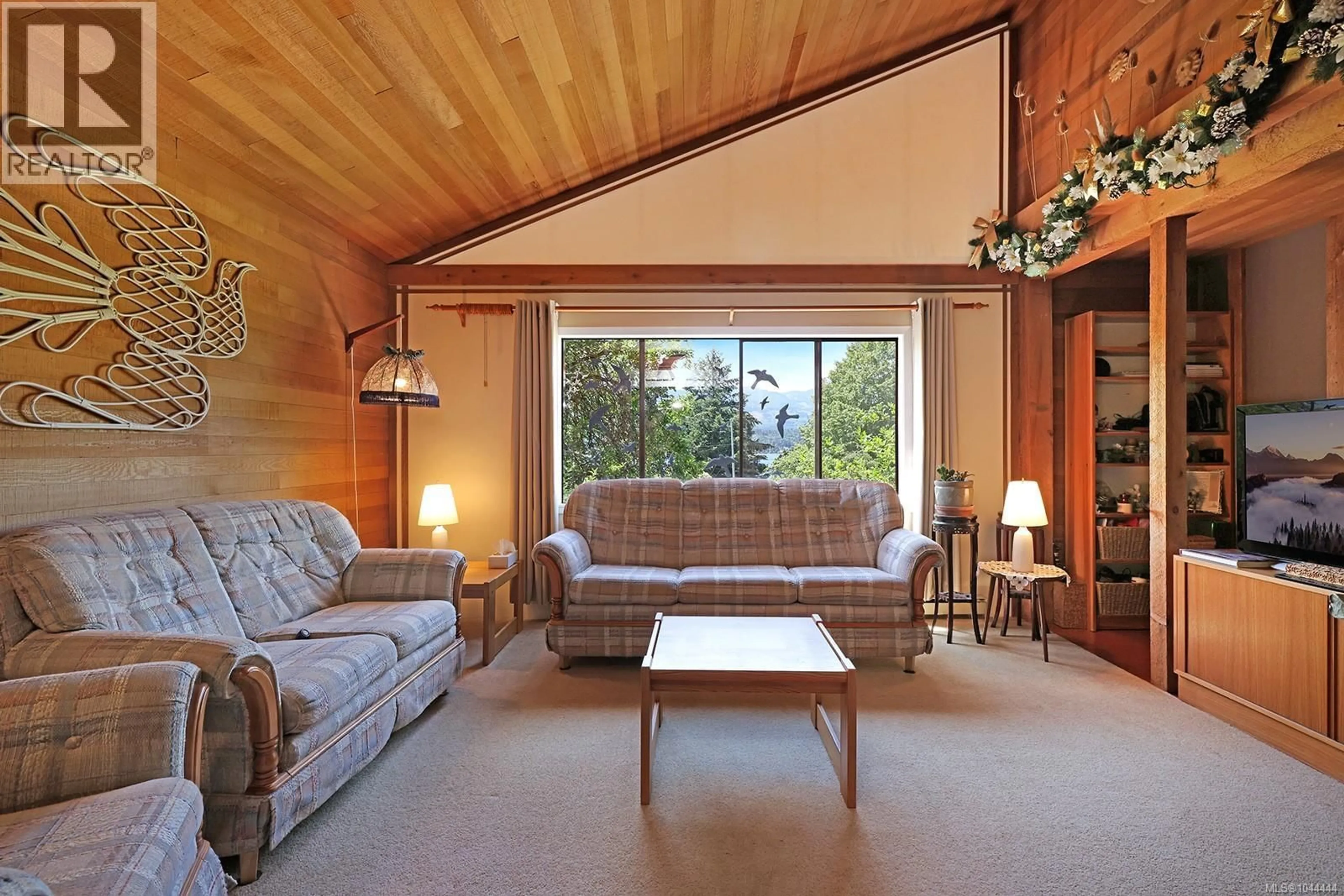 Living room with furniture, wood/laminate floor for 2570 PIERCY ROAD, Denman Island British Columbia V0R1T0