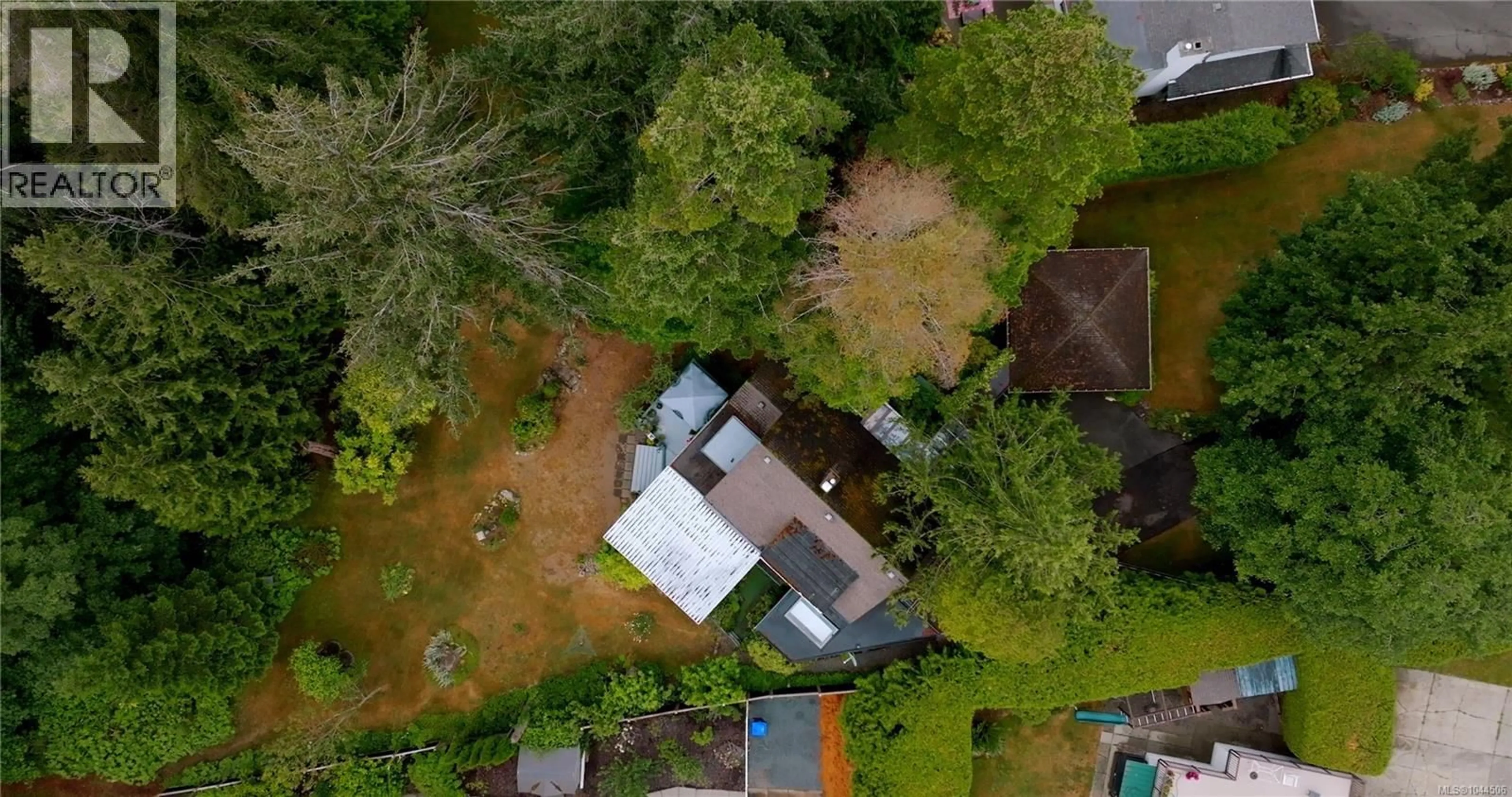 A pic from outside/outdoor area/front of a property/back of a property/a pic from drone, street for 1719 CENTENNIAL AVENUE EAST, Comox British Columbia V9M2W3