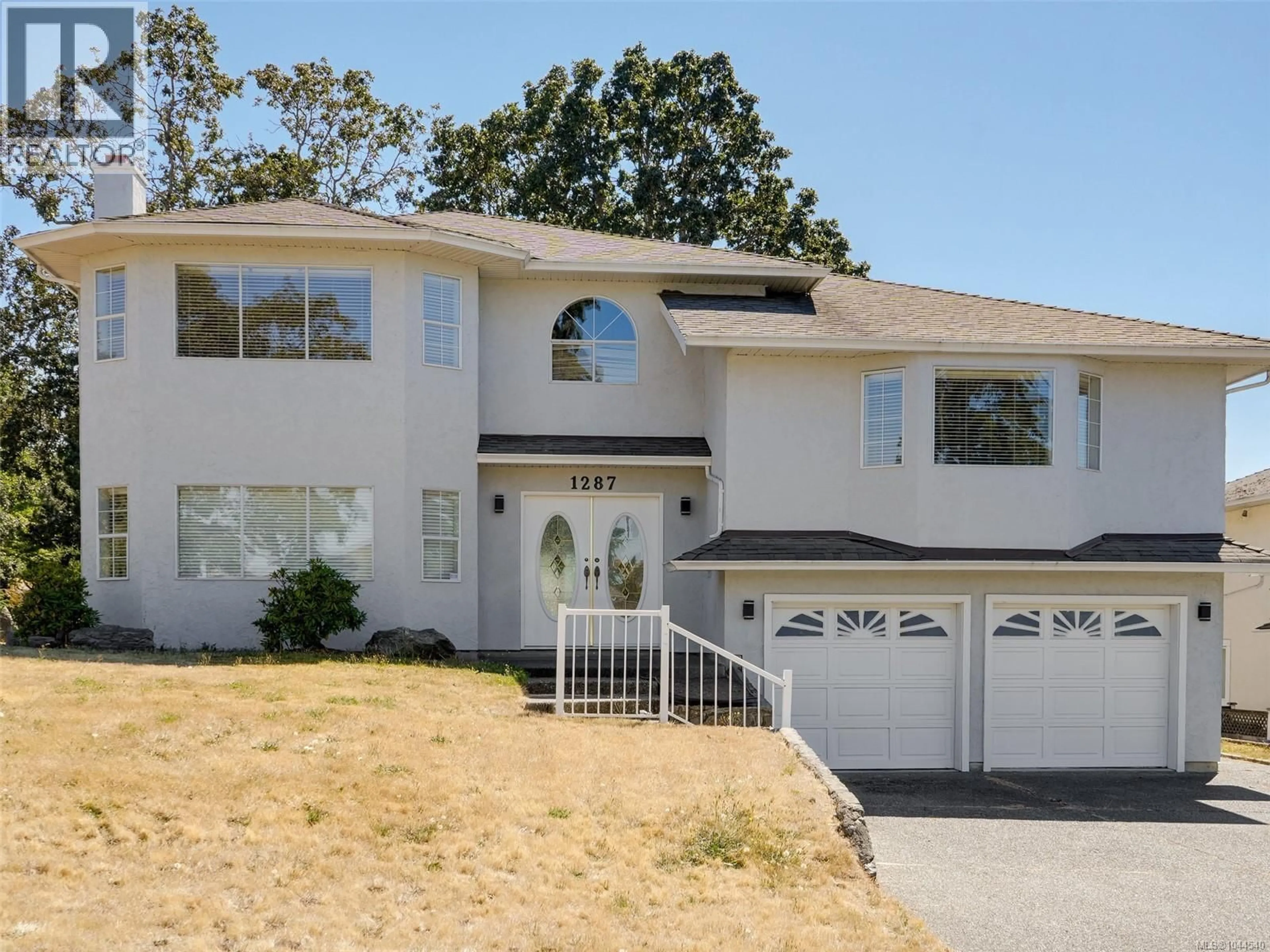 Home with vinyl exterior material, street for 1287 CARMICHAEL COURT, Saanich British Columbia V8Z7B9