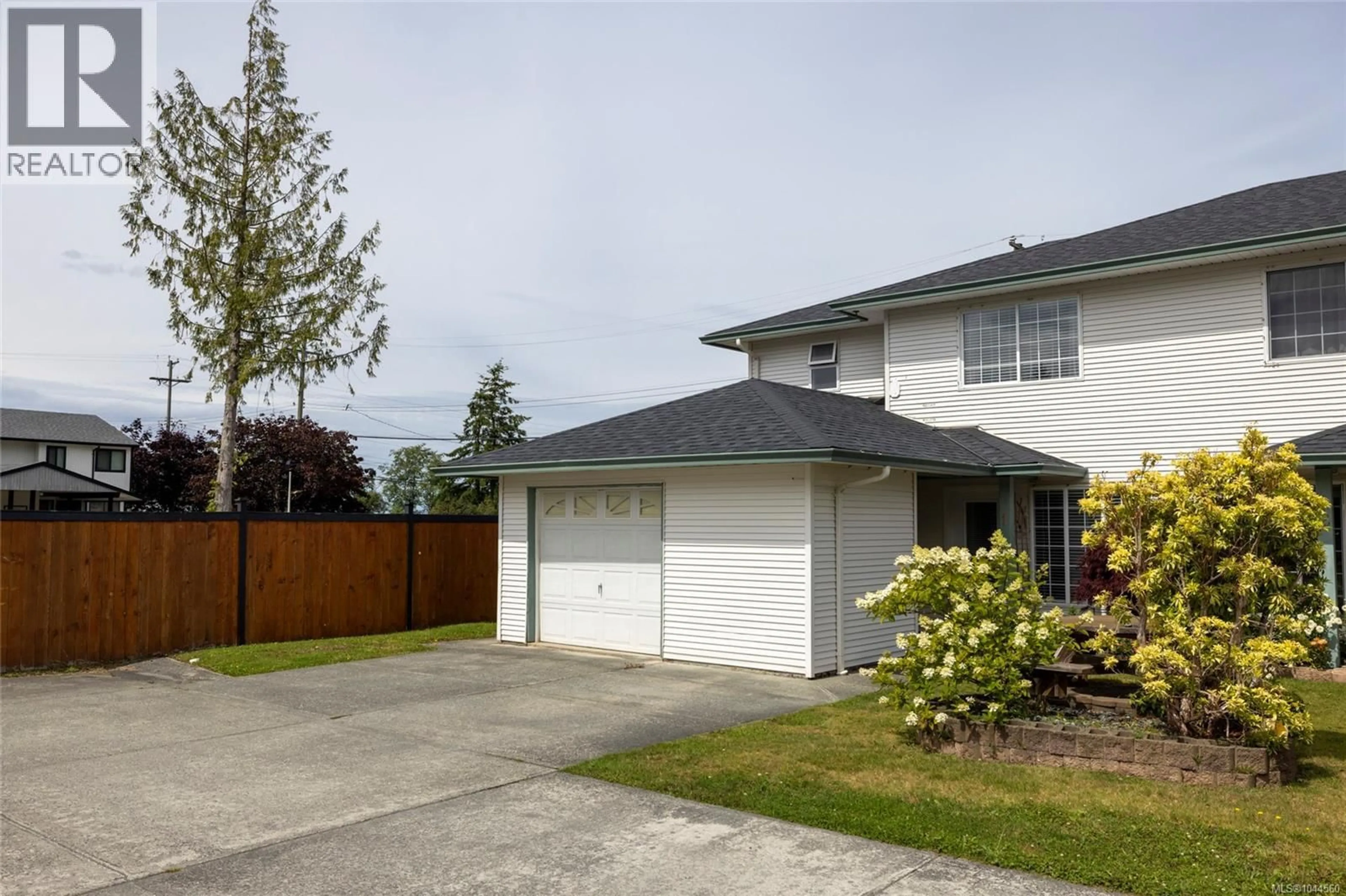Home with vinyl exterior material, street for 1 - 2553 KINGCOME PLACE, Port McNeill British Columbia V0N2R0