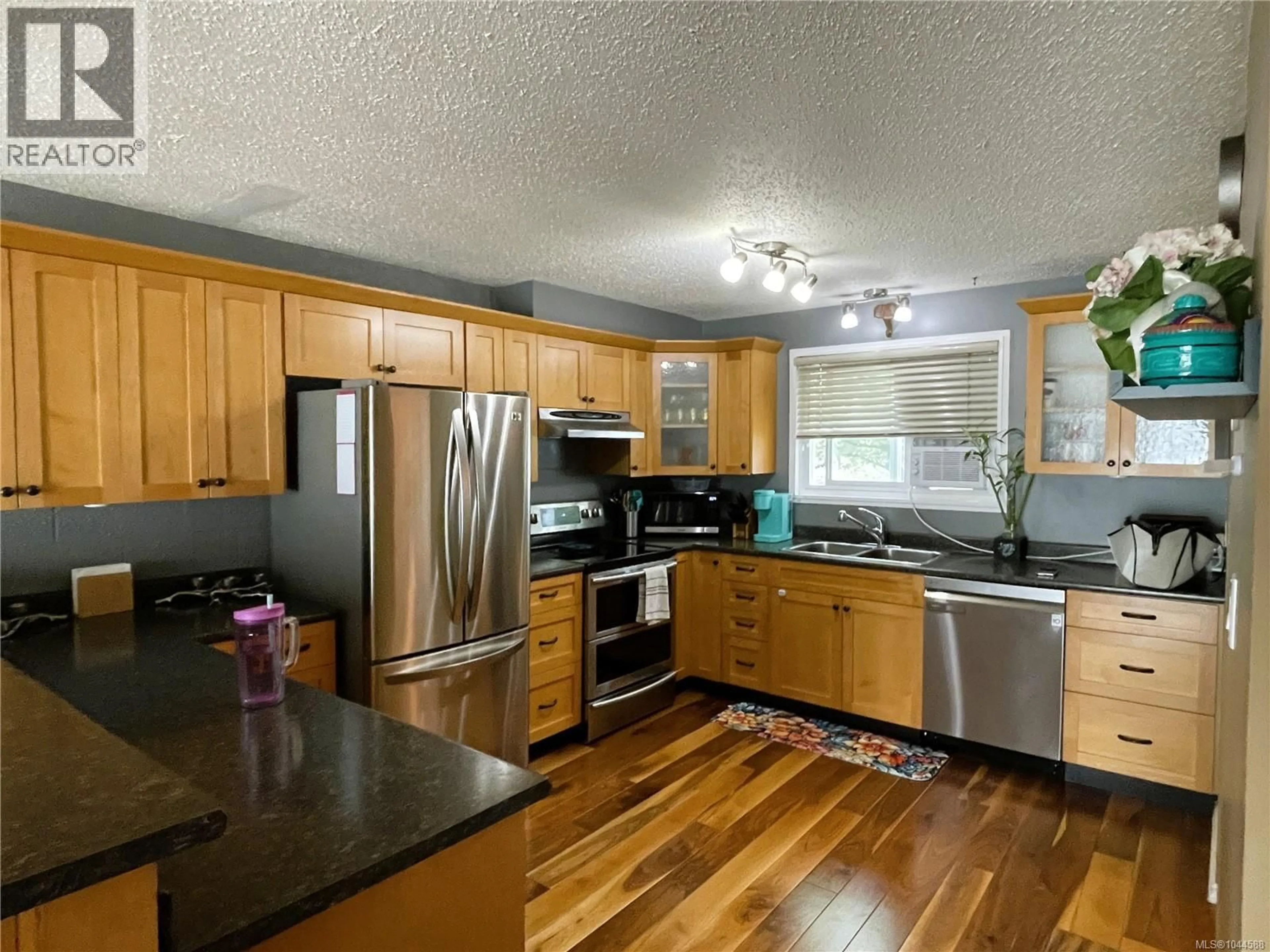 Open concept kitchen, wood/laminate floor for 4251 8TH AVENUE, Port Alberni British Columbia V9Y4S5