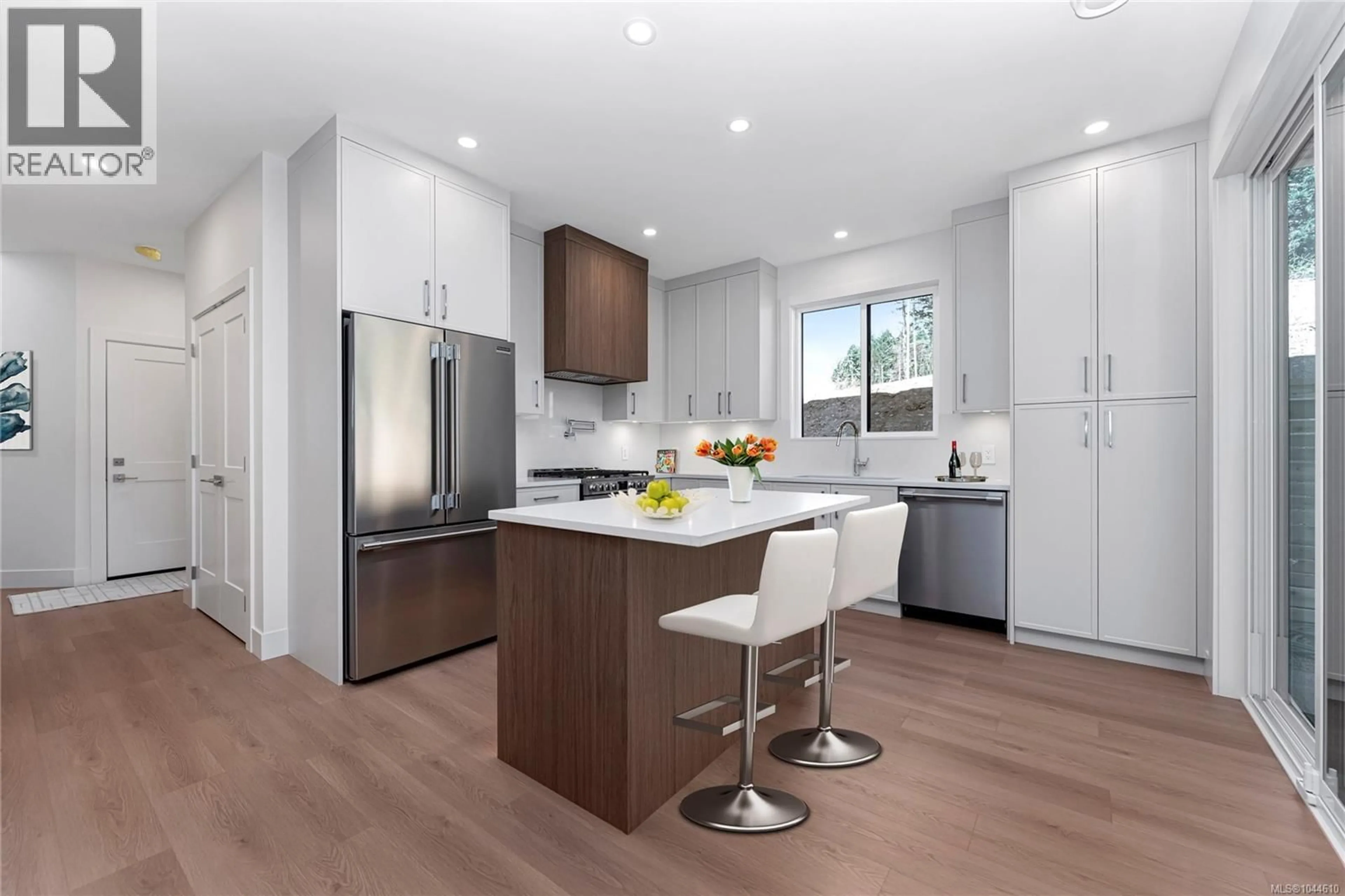 Open concept kitchen, wood/laminate floor for 3847 OLYMPIAN WAY, Colwood British Columbia V9C0R7