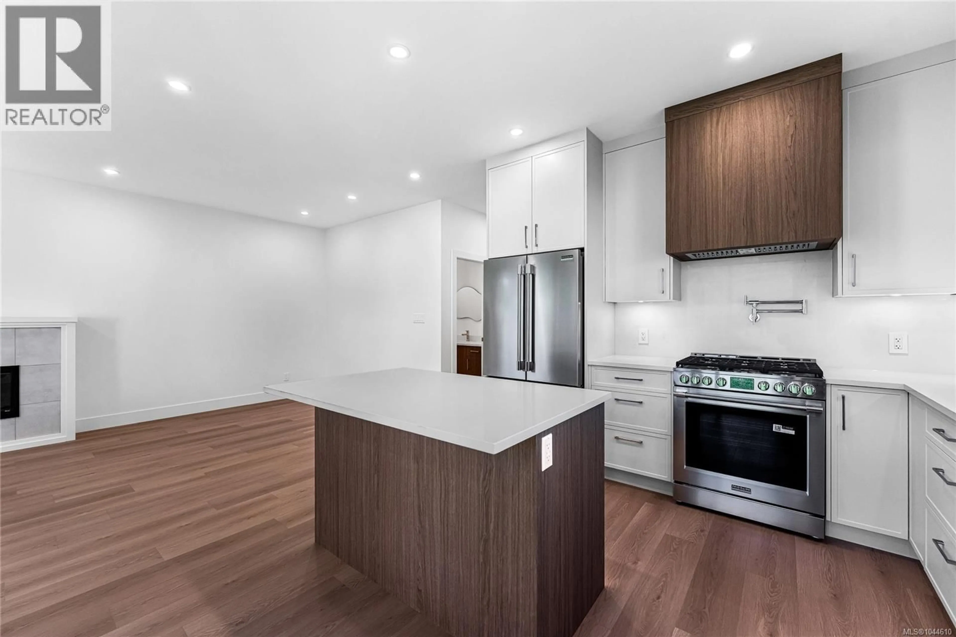 Open concept kitchen, wood/laminate floor for 3847 OLYMPIAN WAY, Colwood British Columbia V9C0R7