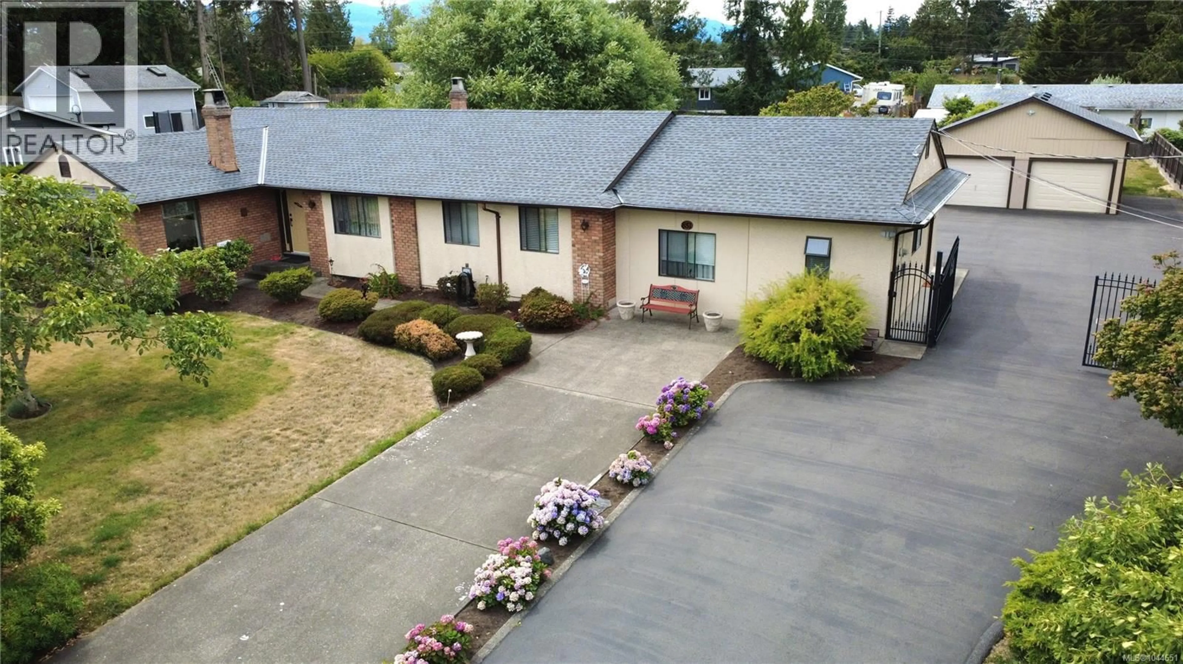 A pic from outside/outdoor area/front of a property/back of a property/a pic from drone, street for 851 BREAKWATER ROAD, French Creek British Columbia V9P1Z8