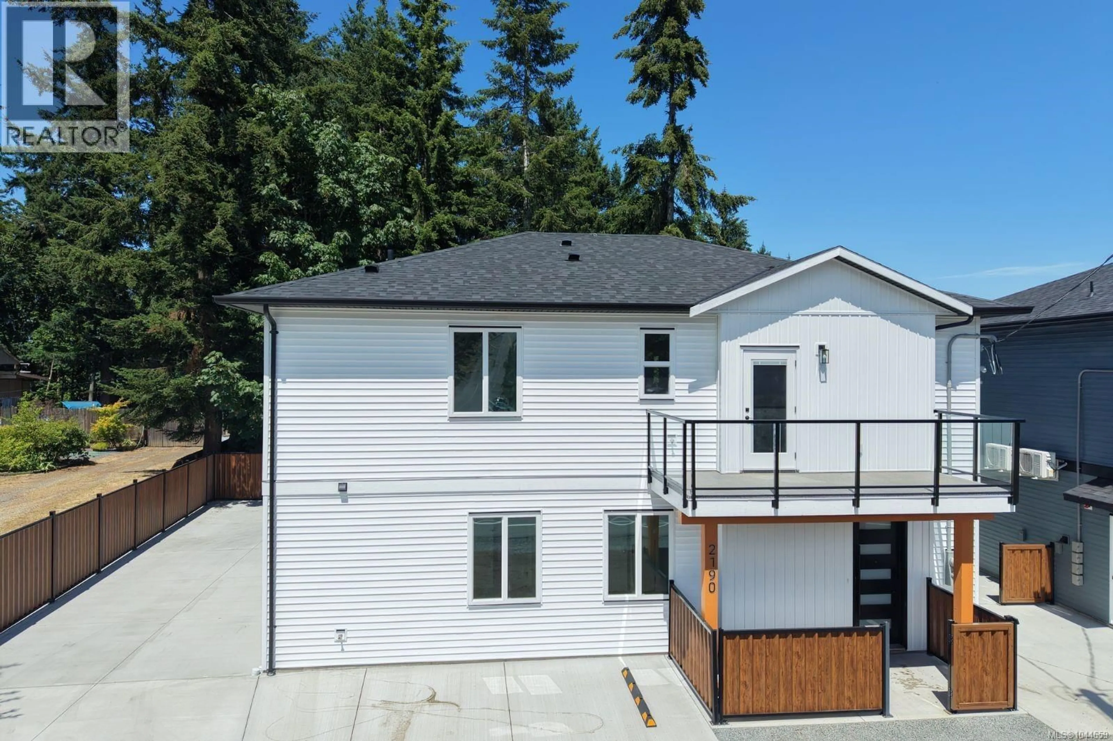 A pic from outside/outdoor area/front of a property/back of a property/a pic from drone, street for 100 - 2190 JINGLE POT ROAD, Nanaimo British Columbia V9R6J2