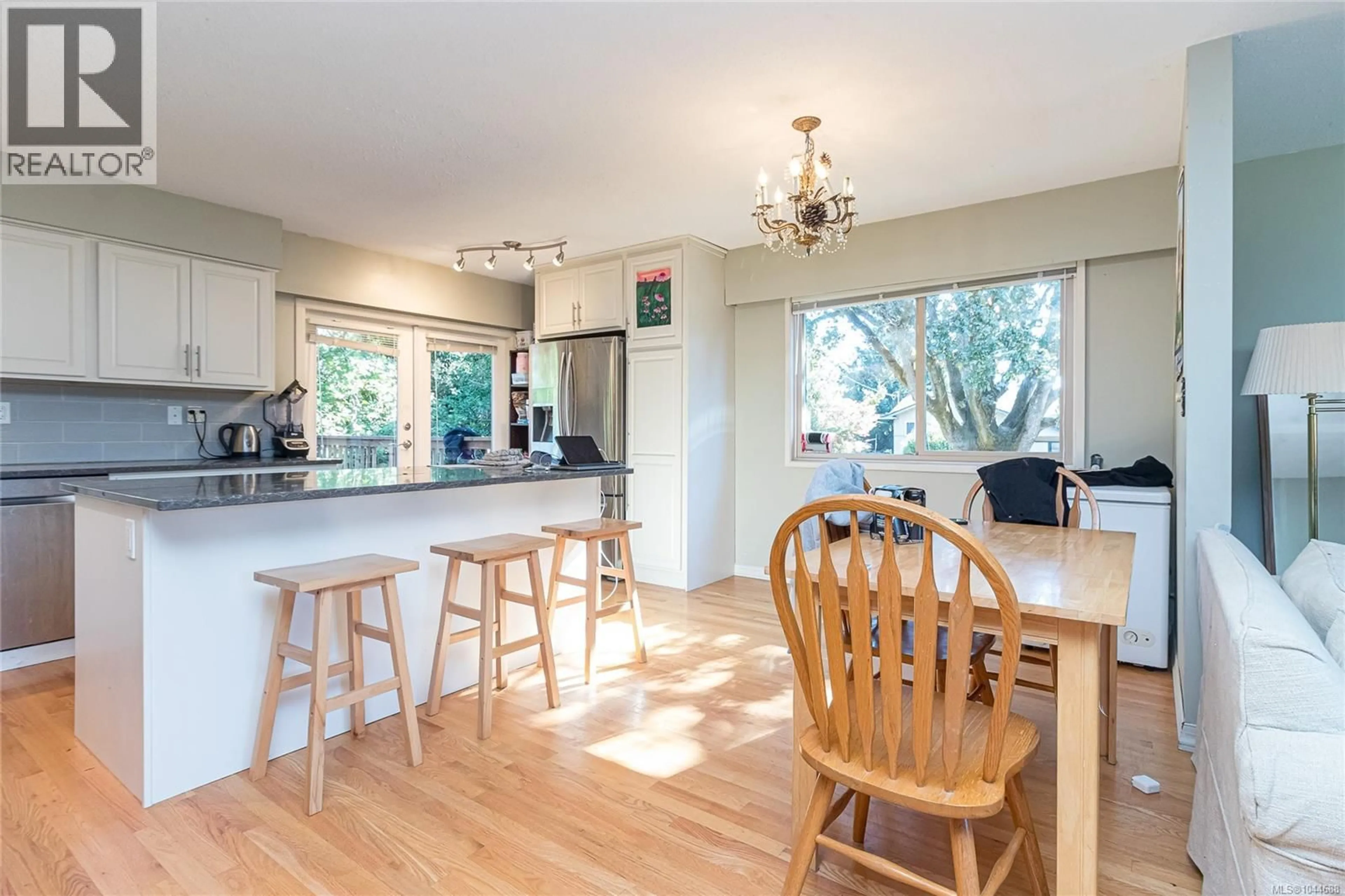 Open concept kitchen, wood/laminate floor for 4167 THORNHILL CRESCENT, Saanich British Columbia V8N5E6