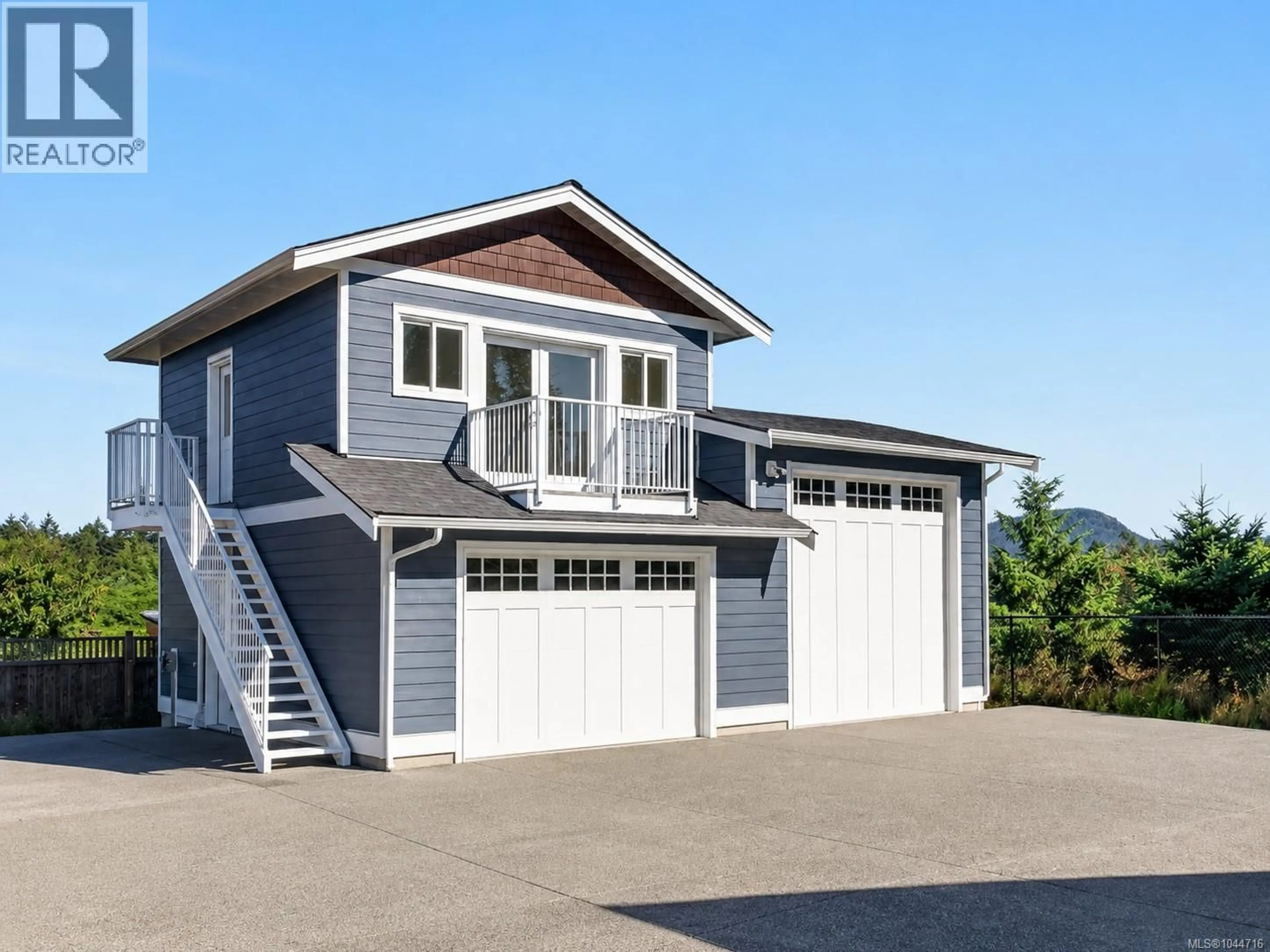 Home with vinyl exterior material, street for 2170 WILDFLOWER ROAD, Shawnigan Lake British Columbia V8H2G1