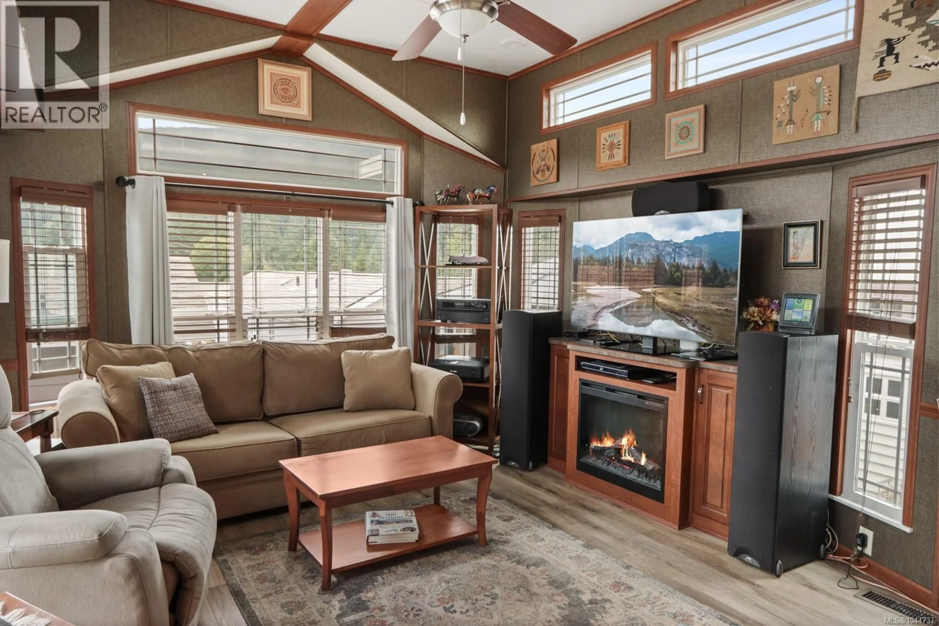 Living room with furniture, wood/laminate floor for 2116 NIMPKISH LAKE WAY, Nanaimo British Columbia V9R0M3