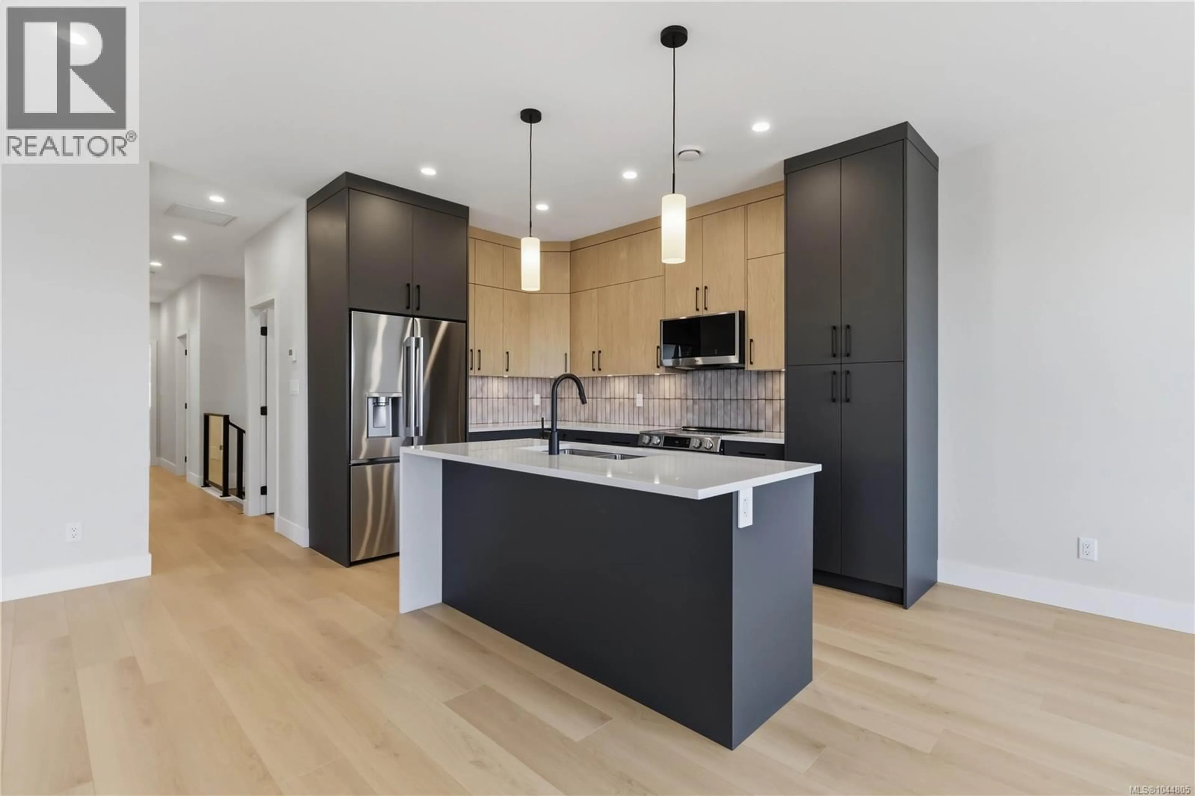 Open concept kitchen, wood/laminate floor for 3482 MERLOT TERRACE, Langford British Columbia V9C0W1