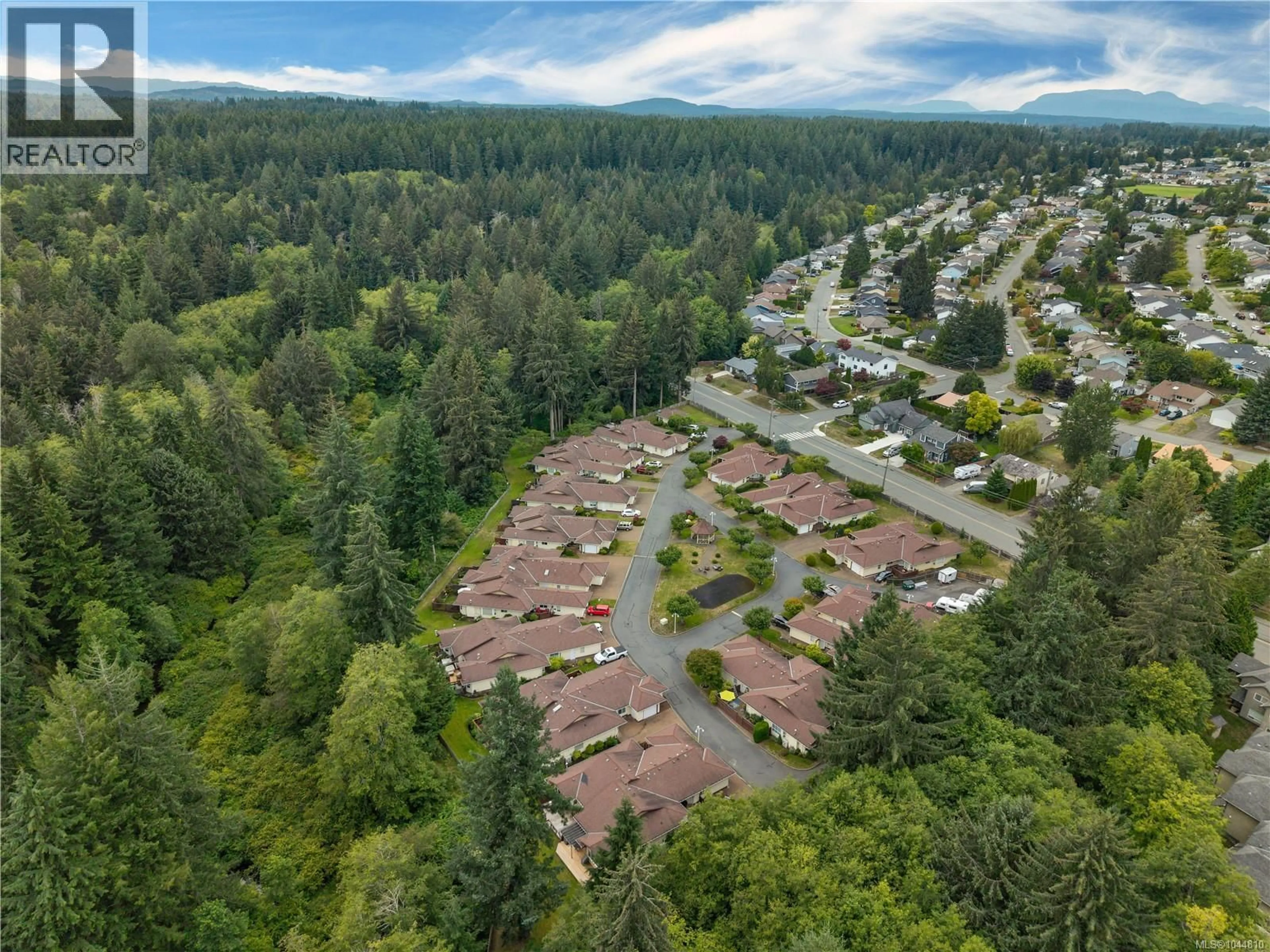 A pic from outside/outdoor area/front of a property/back of a property/a pic from drone, forest/trees view for 9 - 605 ROCKLAND ROAD, Campbell River British Columbia V9W7X1