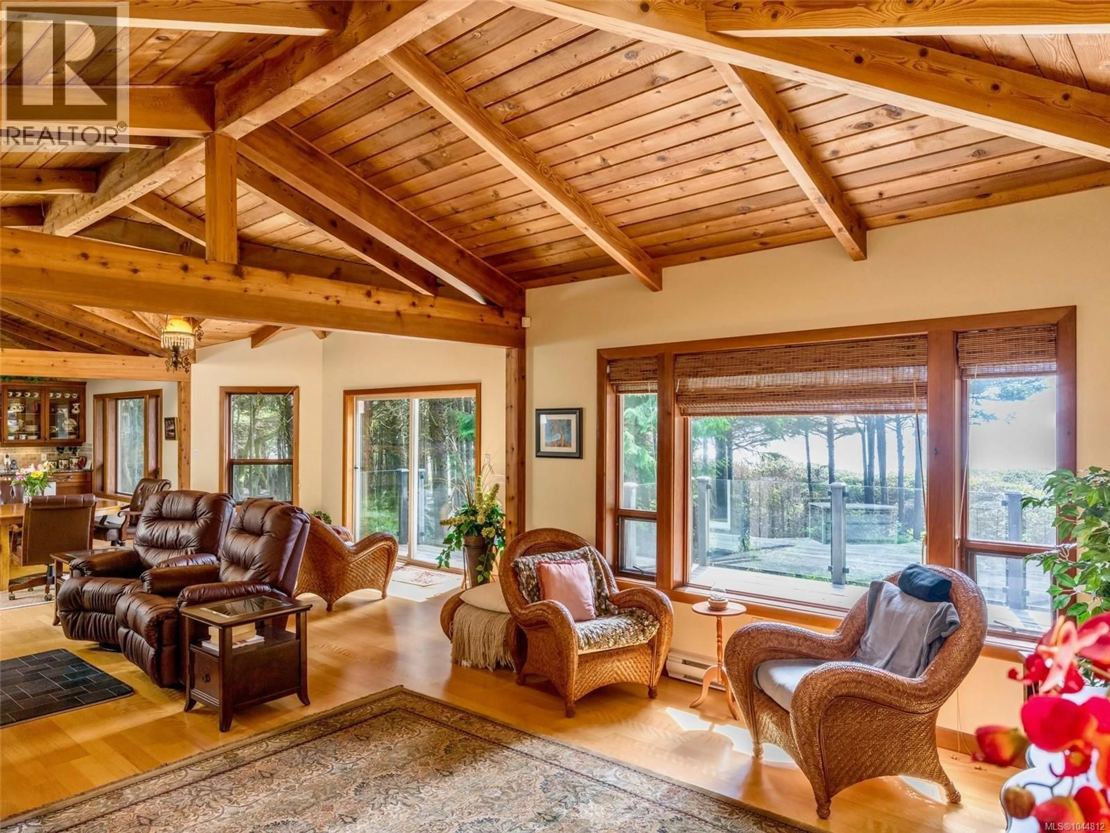 Living room with furniture, wood/laminate floor for 1261 LYNN ROAD, Tofino British Columbia V0R2Z0
