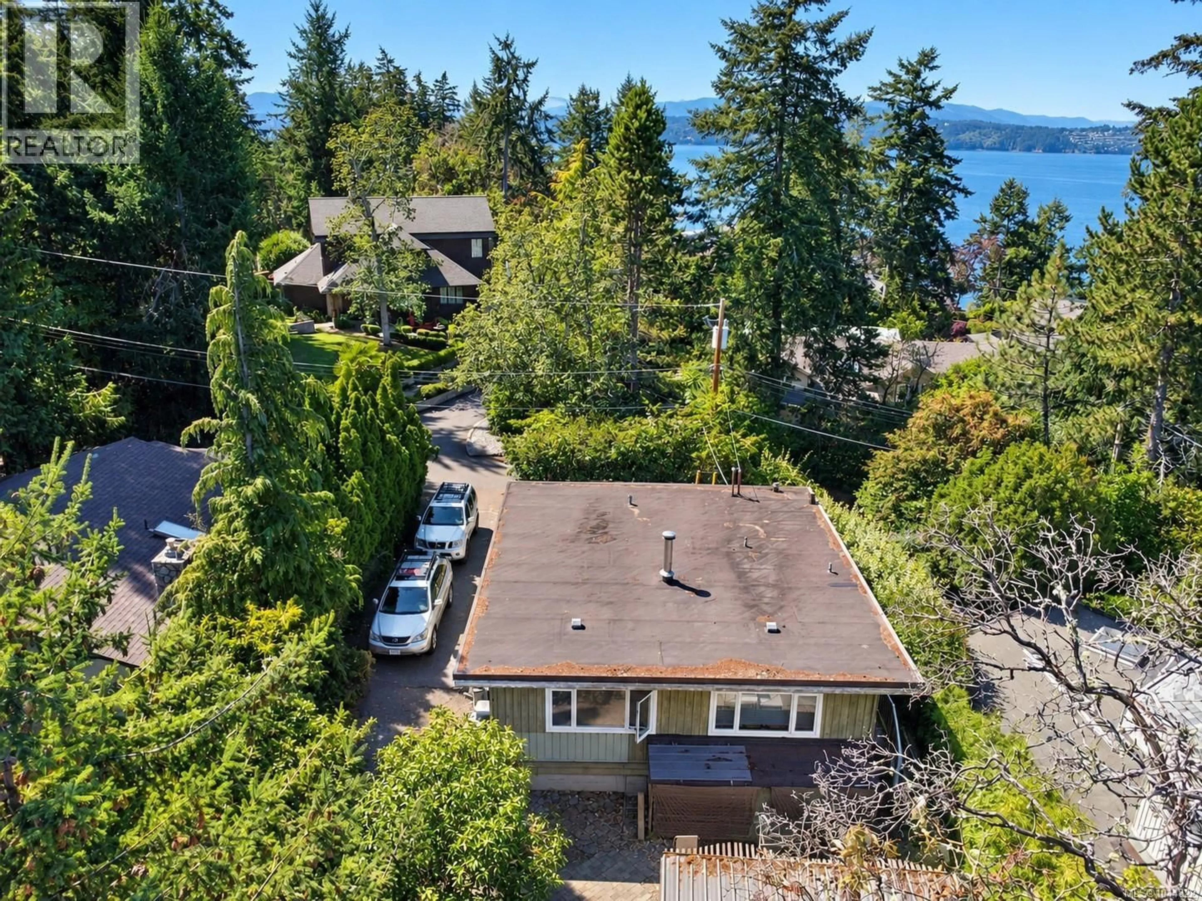 A pic from outside/outdoor area/front of a property/back of a property/a pic from drone, water/lake/river/ocean view for 10959 TUAM ROAD, North Saanich British Columbia V8L5P2