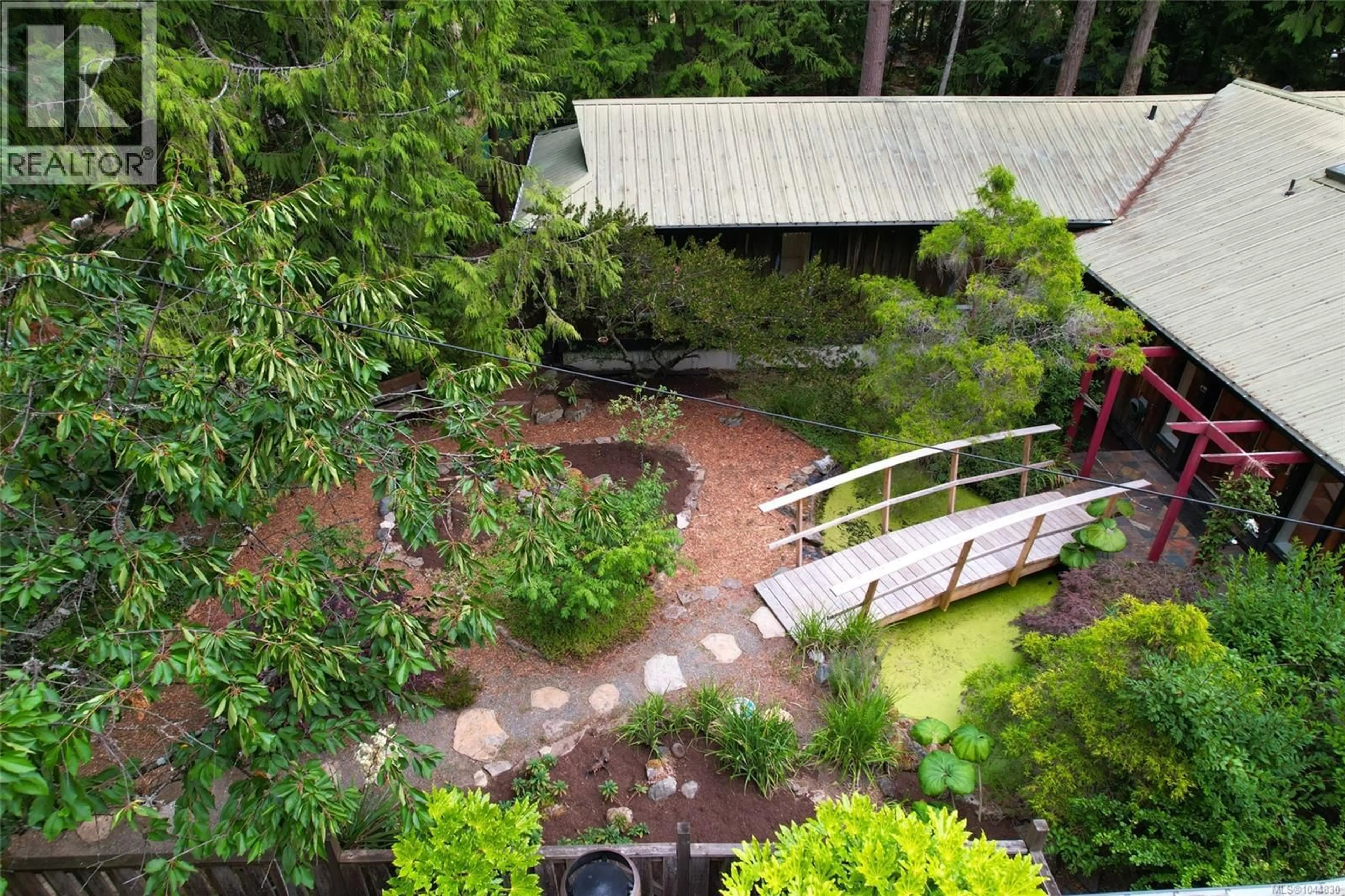 A pic from outside/outdoor area/front of a property/back of a property/a pic from drone, forest/trees view for 395 LYNGAIL PLACE, Gabriola Island British Columbia V0R1X1