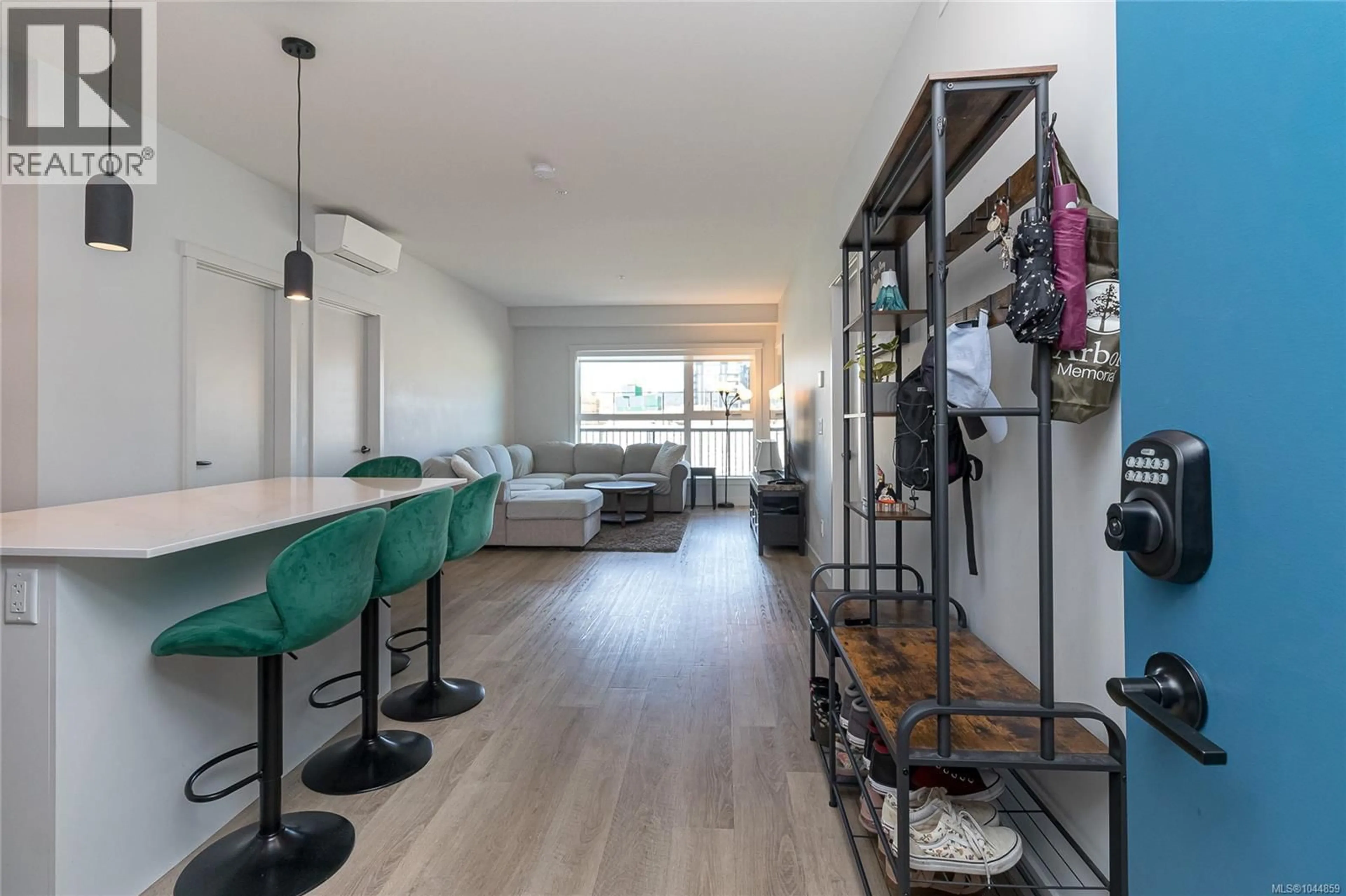 Living room with furniture, wood/laminate floor for 301 - 2465 GATEWAY ROAD, Langford British Columbia V9B5X3