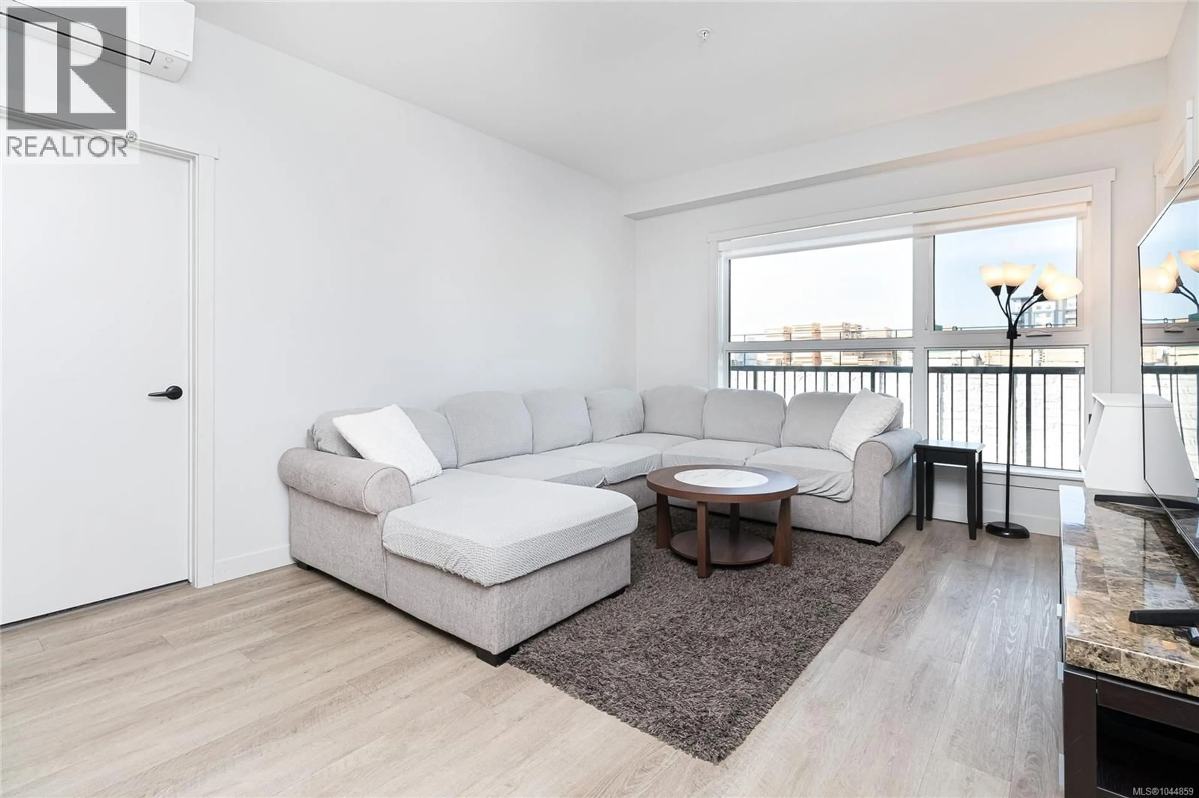Living room with furniture, wood/laminate floor for 301 - 2465 GATEWAY ROAD, Langford British Columbia V9B5X3