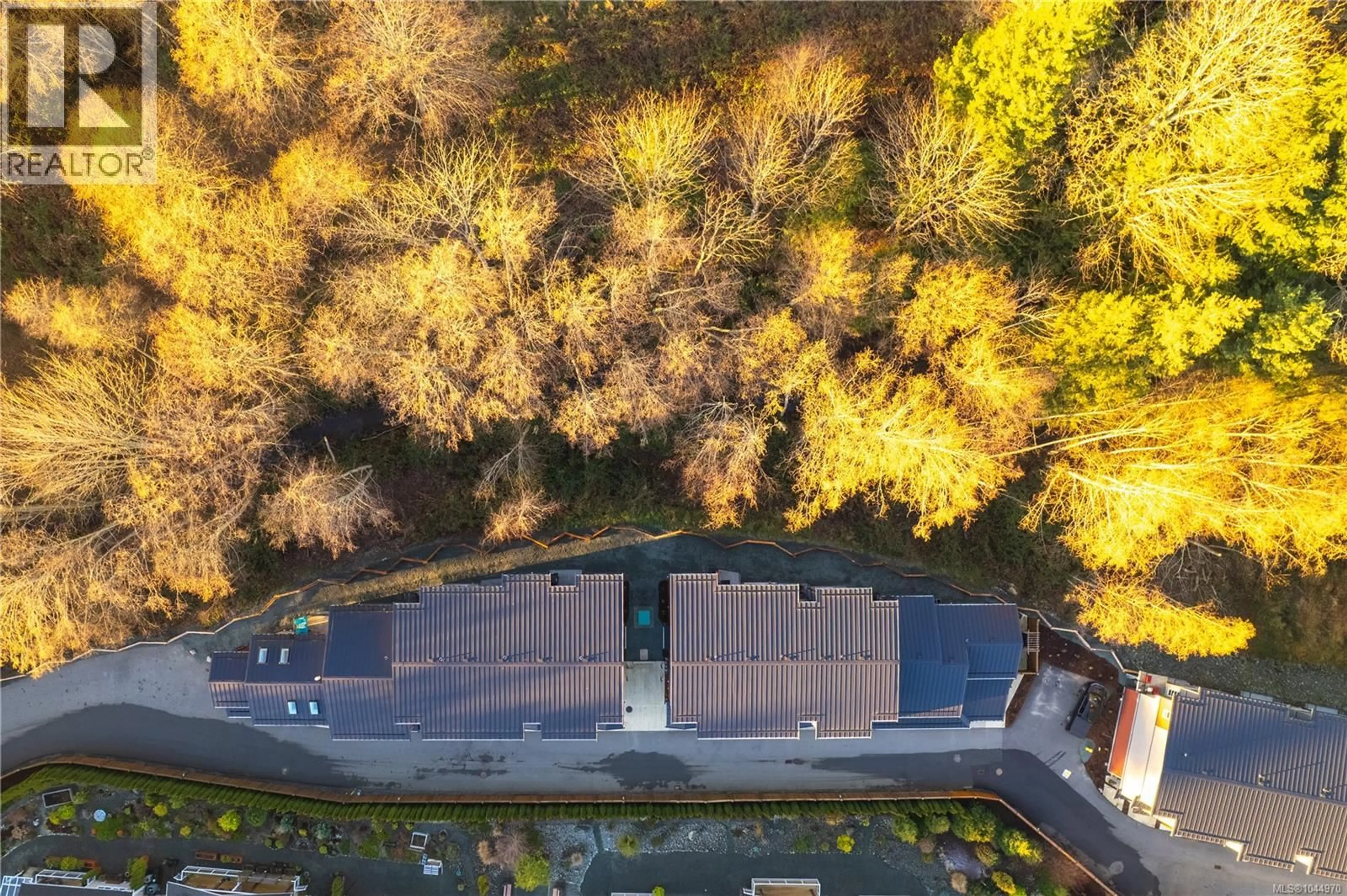 A pic from outside/outdoor area/front of a property/back of a property/a pic from drone, forest/trees view for 107 - 2899 RIVER ROAD, Chemainus British Columbia V0R1K3