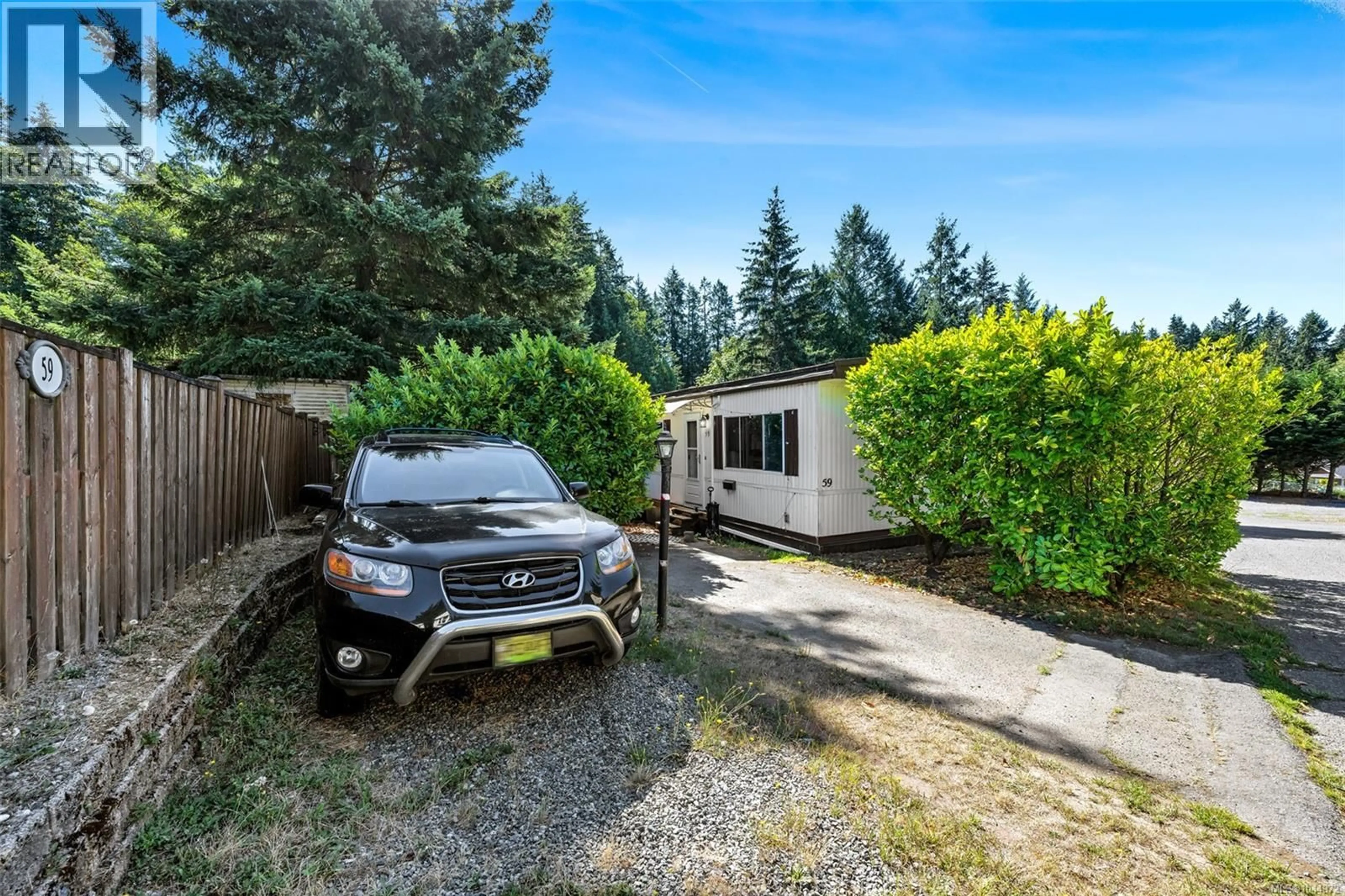 A pic from outside/outdoor area/front of a property/back of a property/a pic from drone, street for 59 - 2785 WALLBANK ROAD, Shawnigan Lake British Columbia V0R2W2