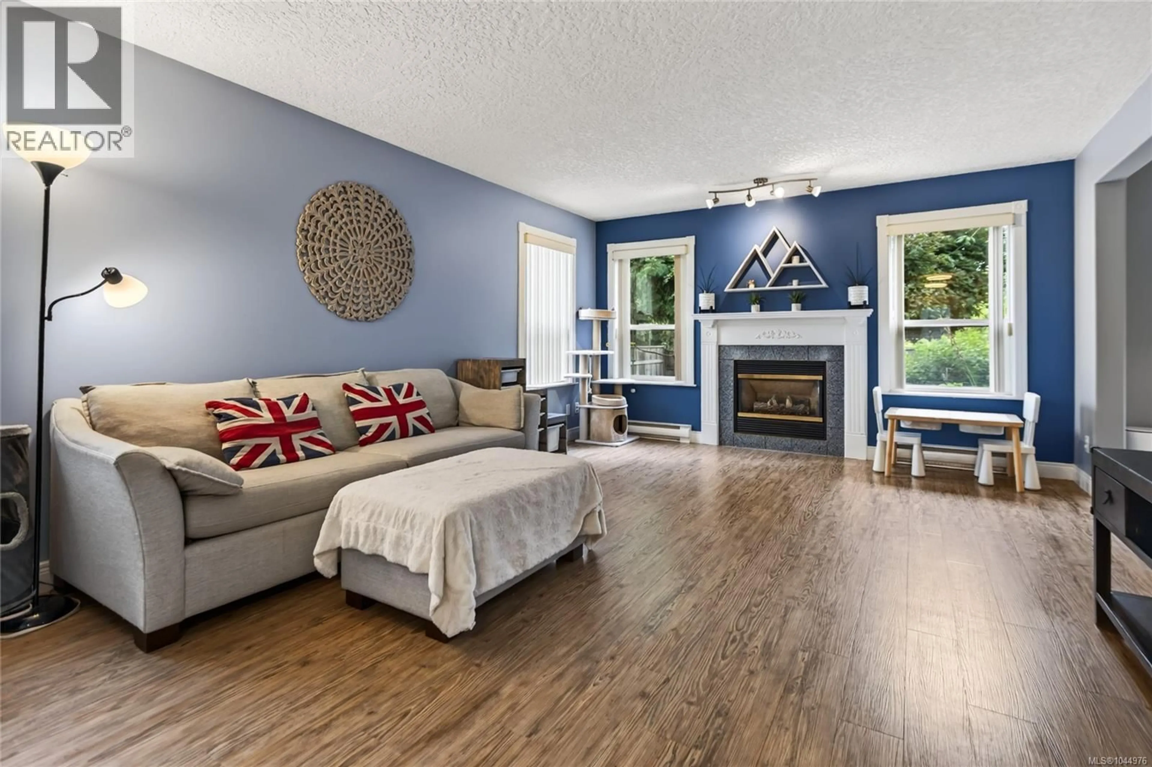 Living room with furniture, wood/laminate floor for A - 1820 1ST STREET, Courtenay British Columbia V9N6V5
