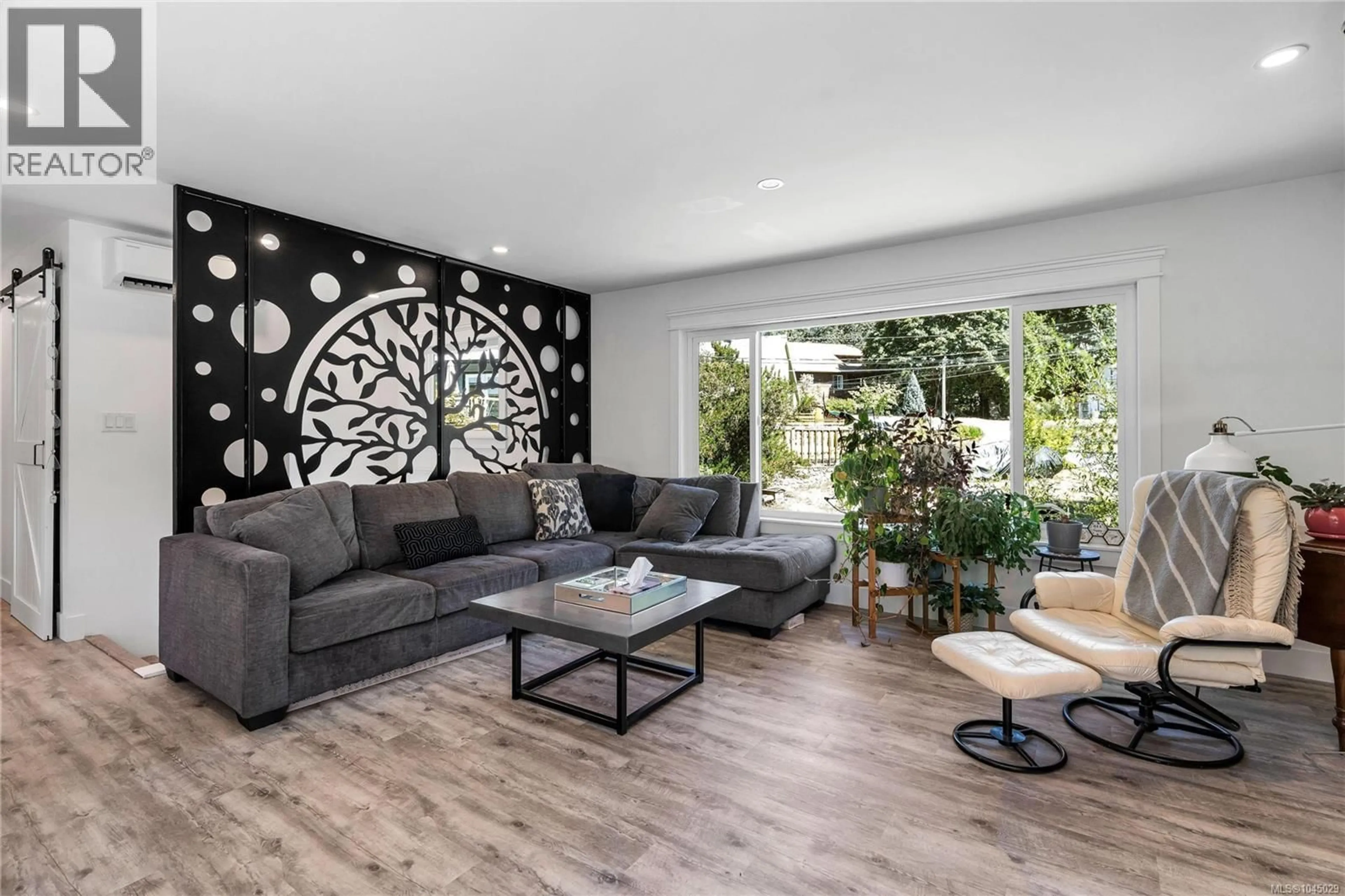 Living room with furniture, wood/laminate floor for 619 SANDRA PLACE, Langford British Columbia V9B4Y2