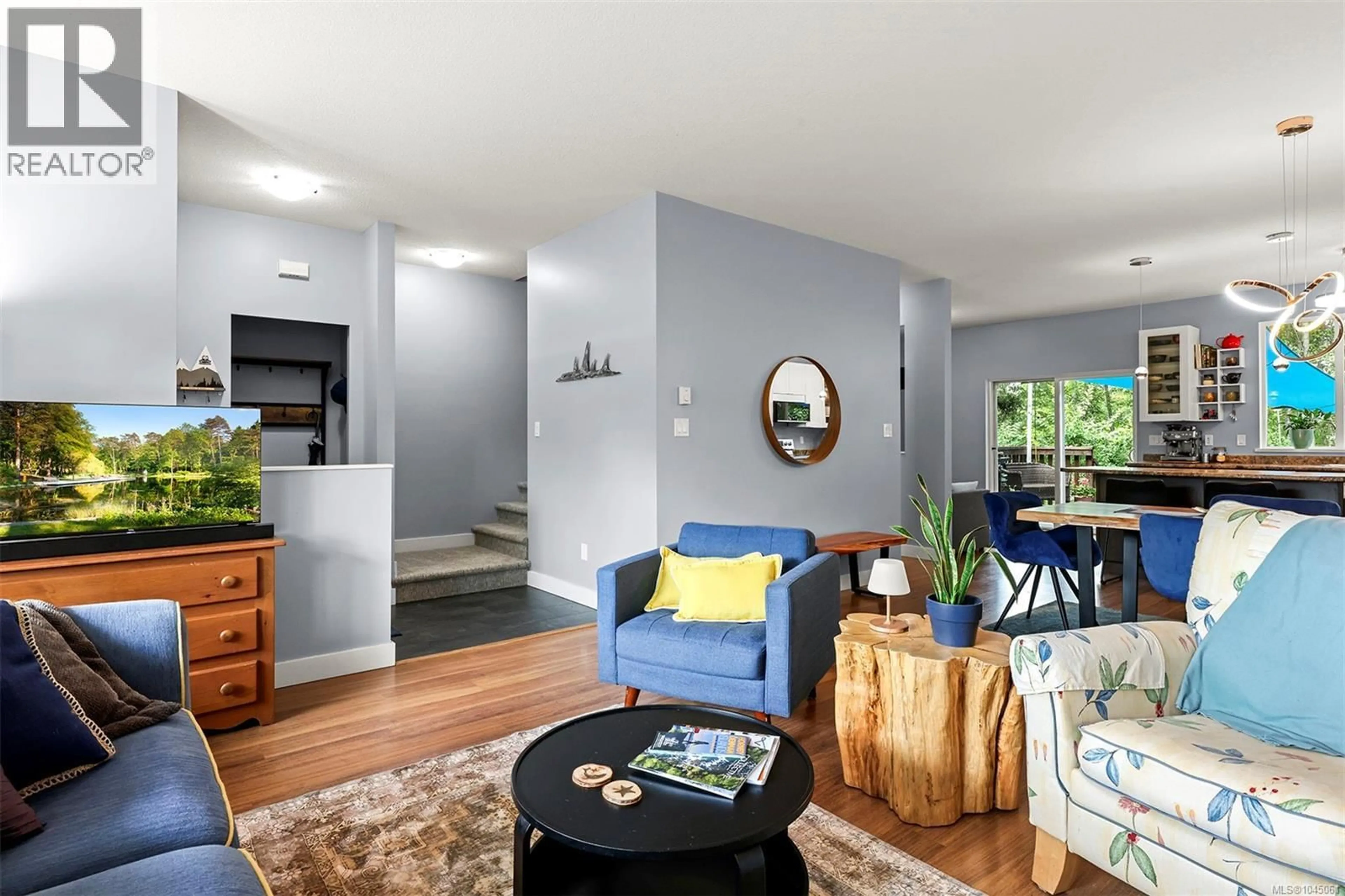 Living room with furniture, wood/laminate floor for 3354 CONISTON CRESCENT, Cumberland British Columbia V0R1S0