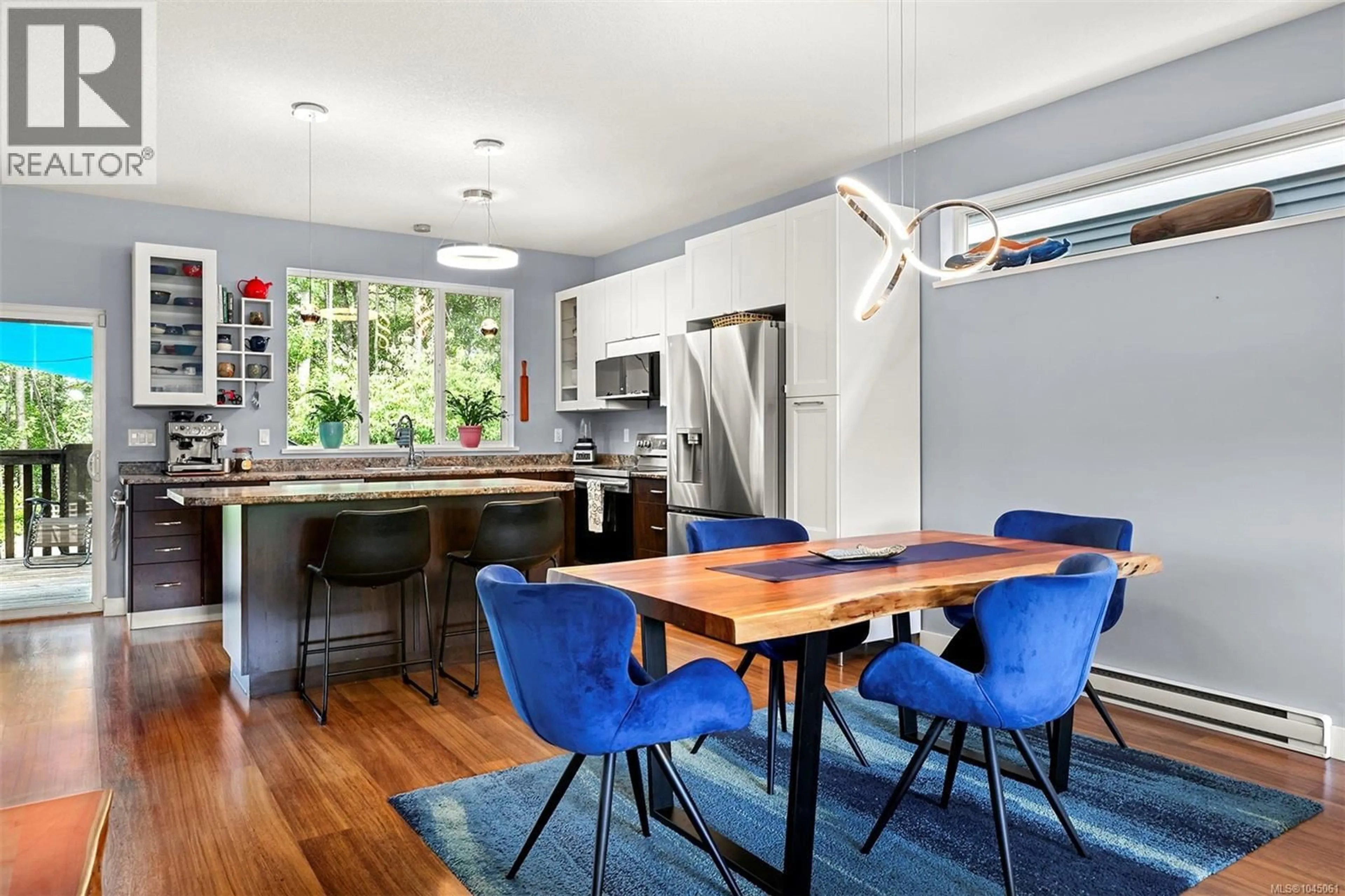 Open concept kitchen, wood/laminate floor for 3354 CONISTON CRESCENT, Cumberland British Columbia V0R1S0