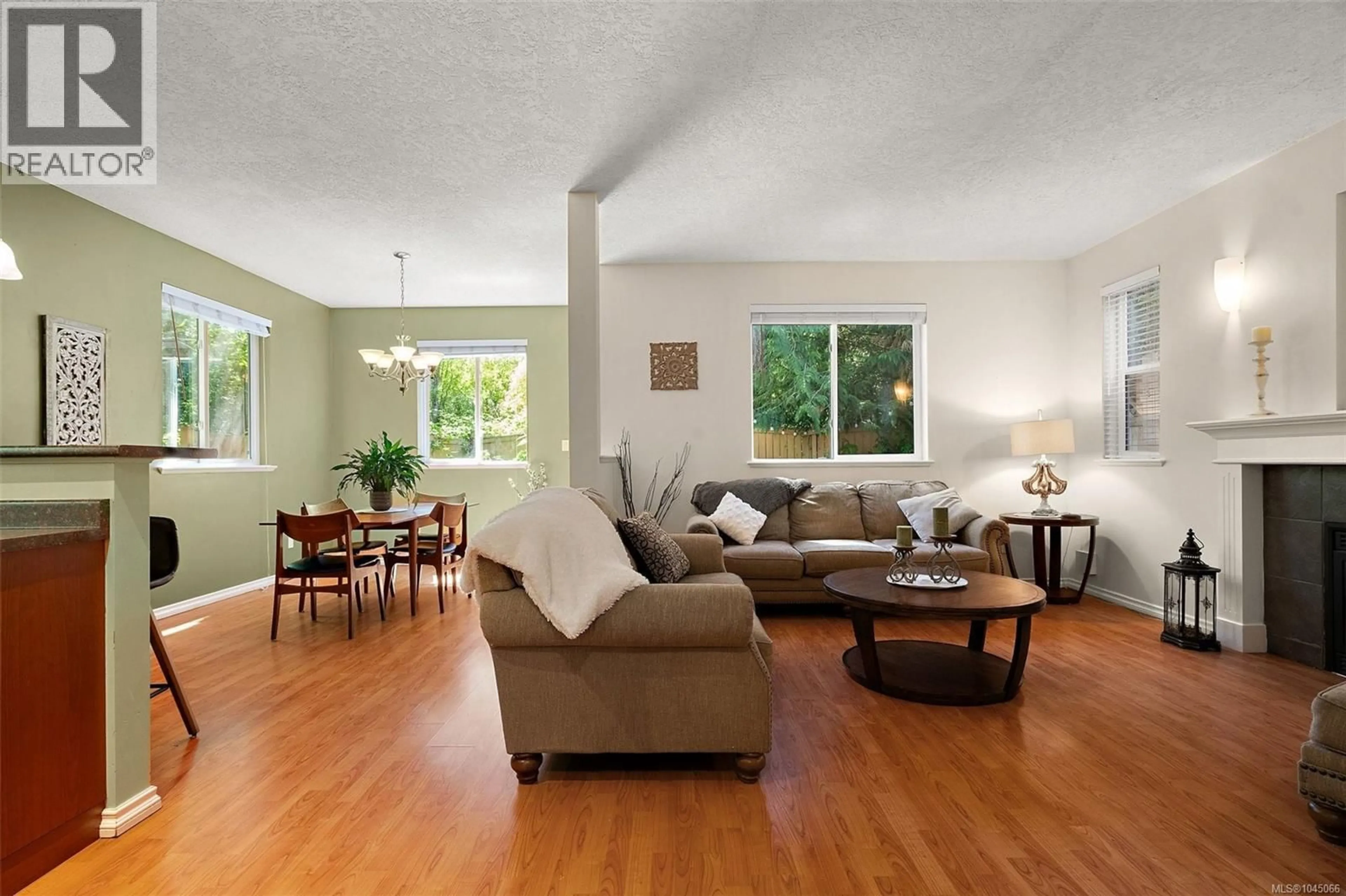 Living room with furniture, wood/laminate floor for 989 WILD POND LANE, Langford British Columbia V9C4M7