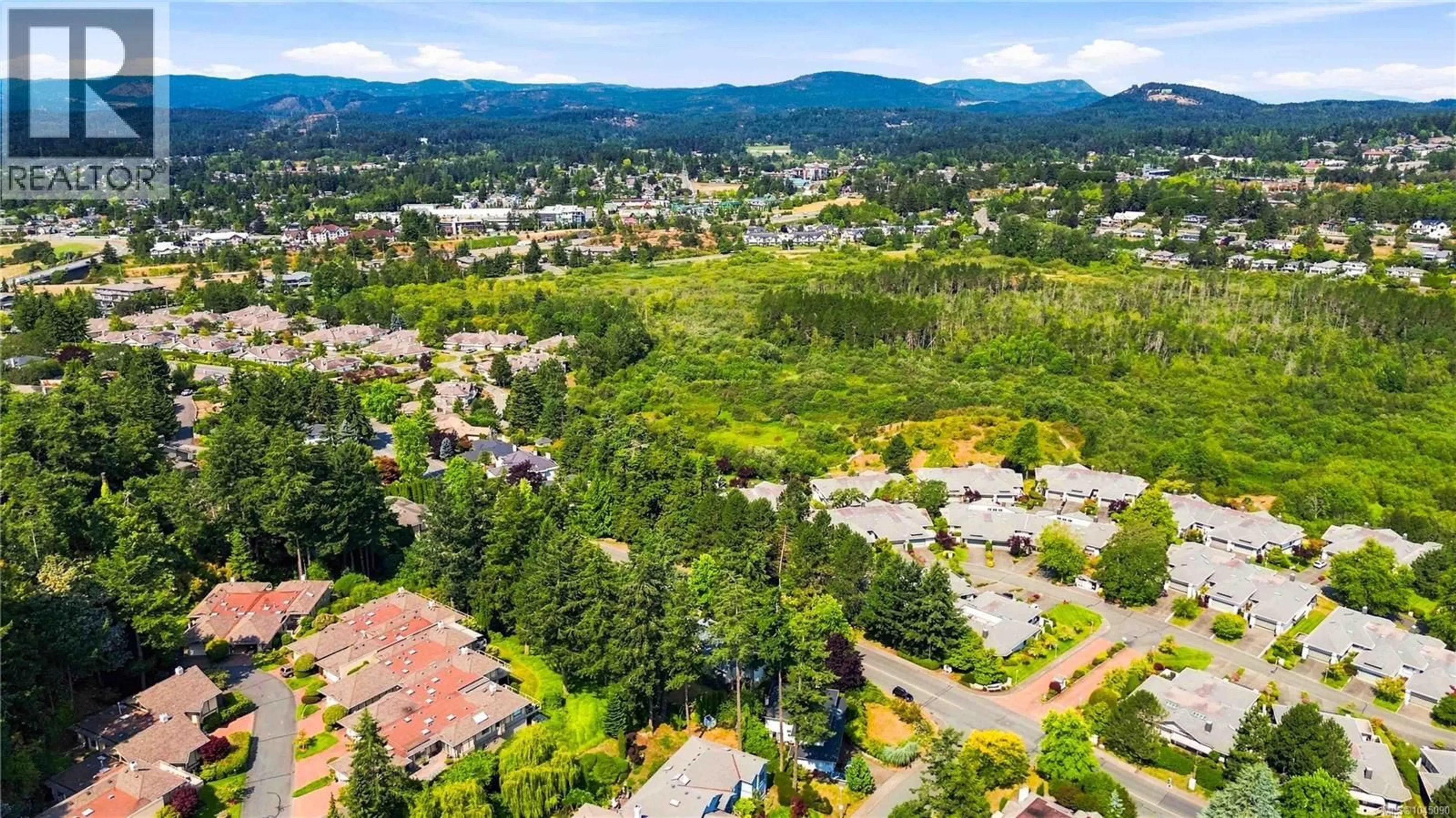 A pic from outside/outdoor area/front of a property/back of a property/a pic from drone, mountain view for 4355 EMILY CARR DRIVE, Saanich British Columbia V8X5E3