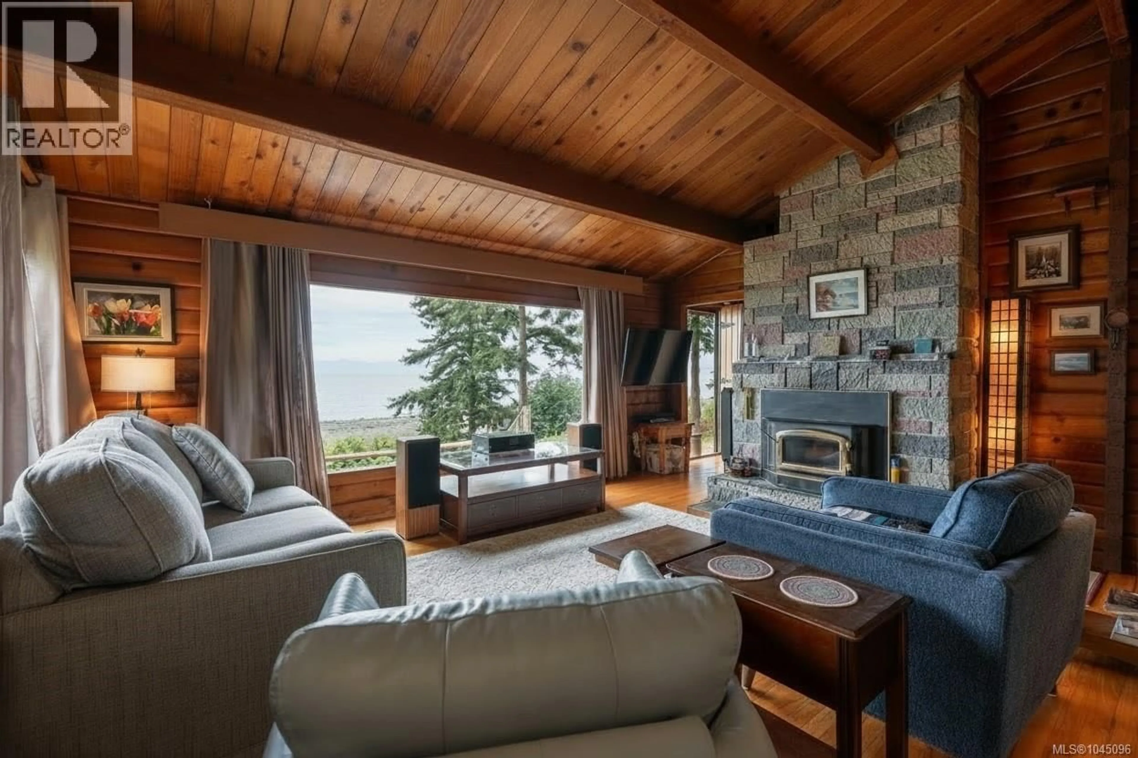 Living room with furniture, wood/laminate floor for 2310 SEABANK ROAD, Courtenay British Columbia V9J1Y2