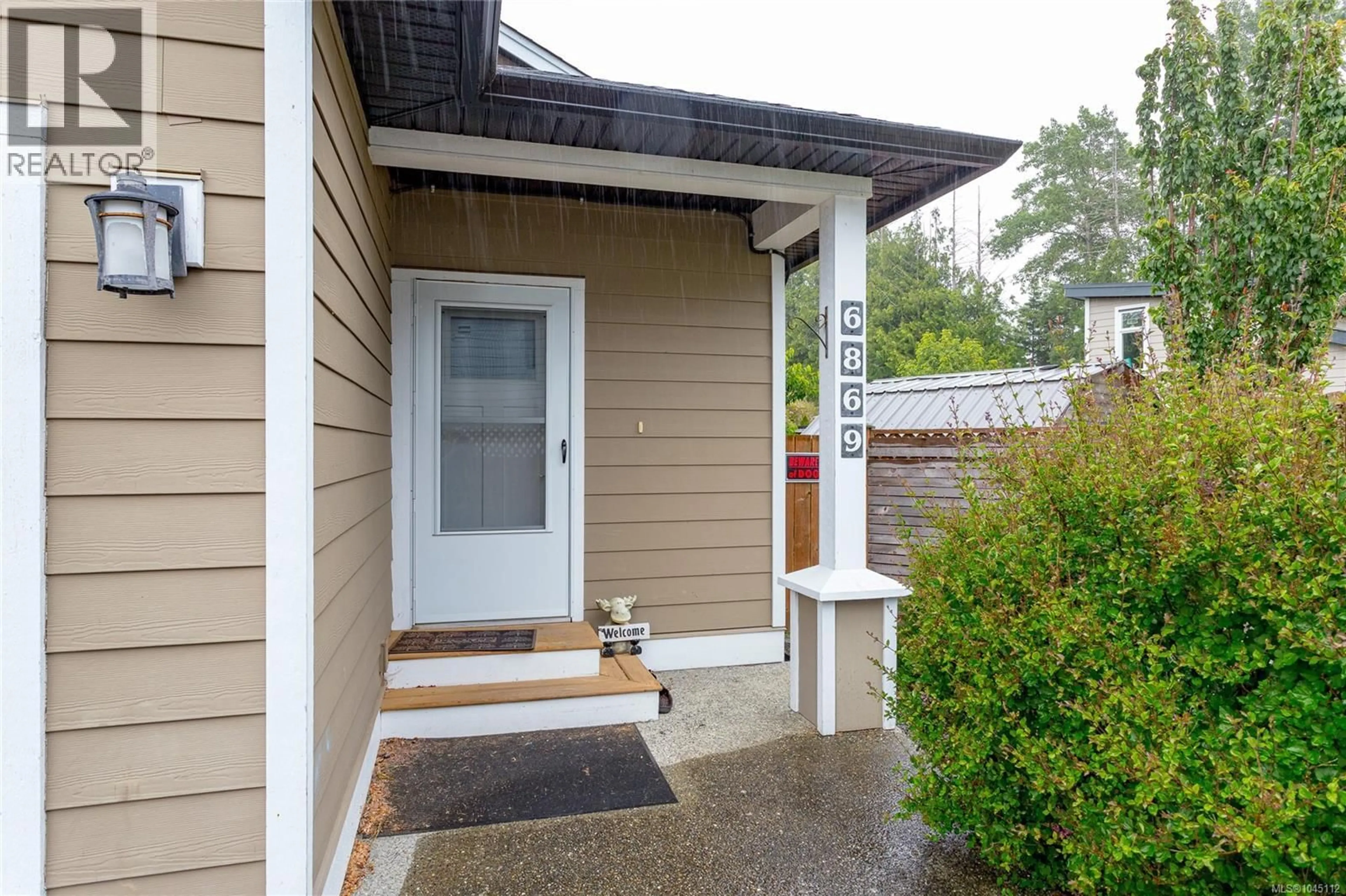 Home with vinyl exterior material, street for 6869 LAURA'S LANE, Sooke British Columbia V9Z0P8