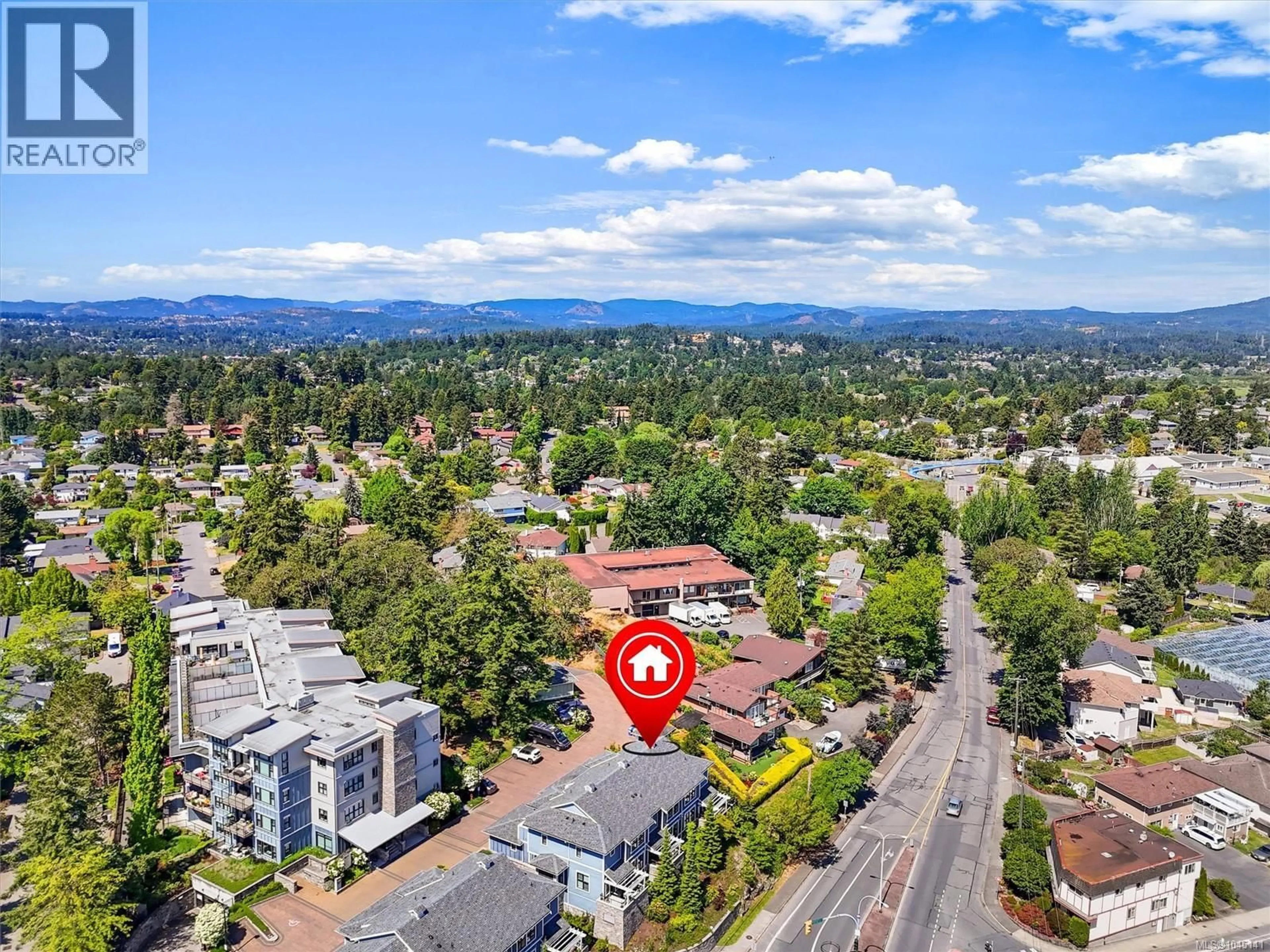 A pic from outside/outdoor area/front of a property/back of a property/a pic from drone, mountain view for 101 - 3916 CAREY ROAD, Saanich British Columbia V8Z4E2
