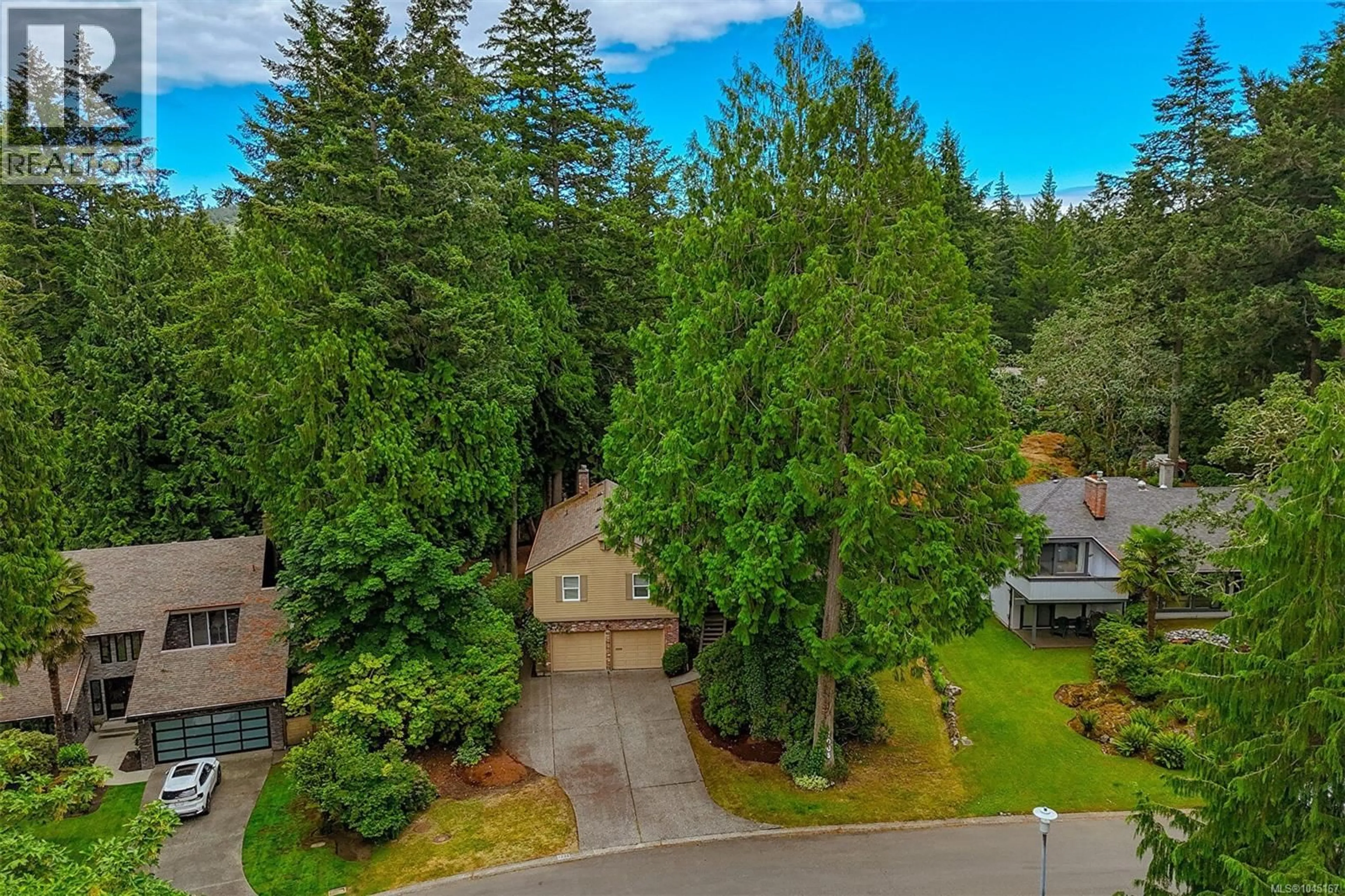A pic from outside/outdoor area/front of a property/back of a property/a pic from drone, forest/trees view for 1005 KENTWOOD PLACE, Saanich British Columbia V8Y2R2