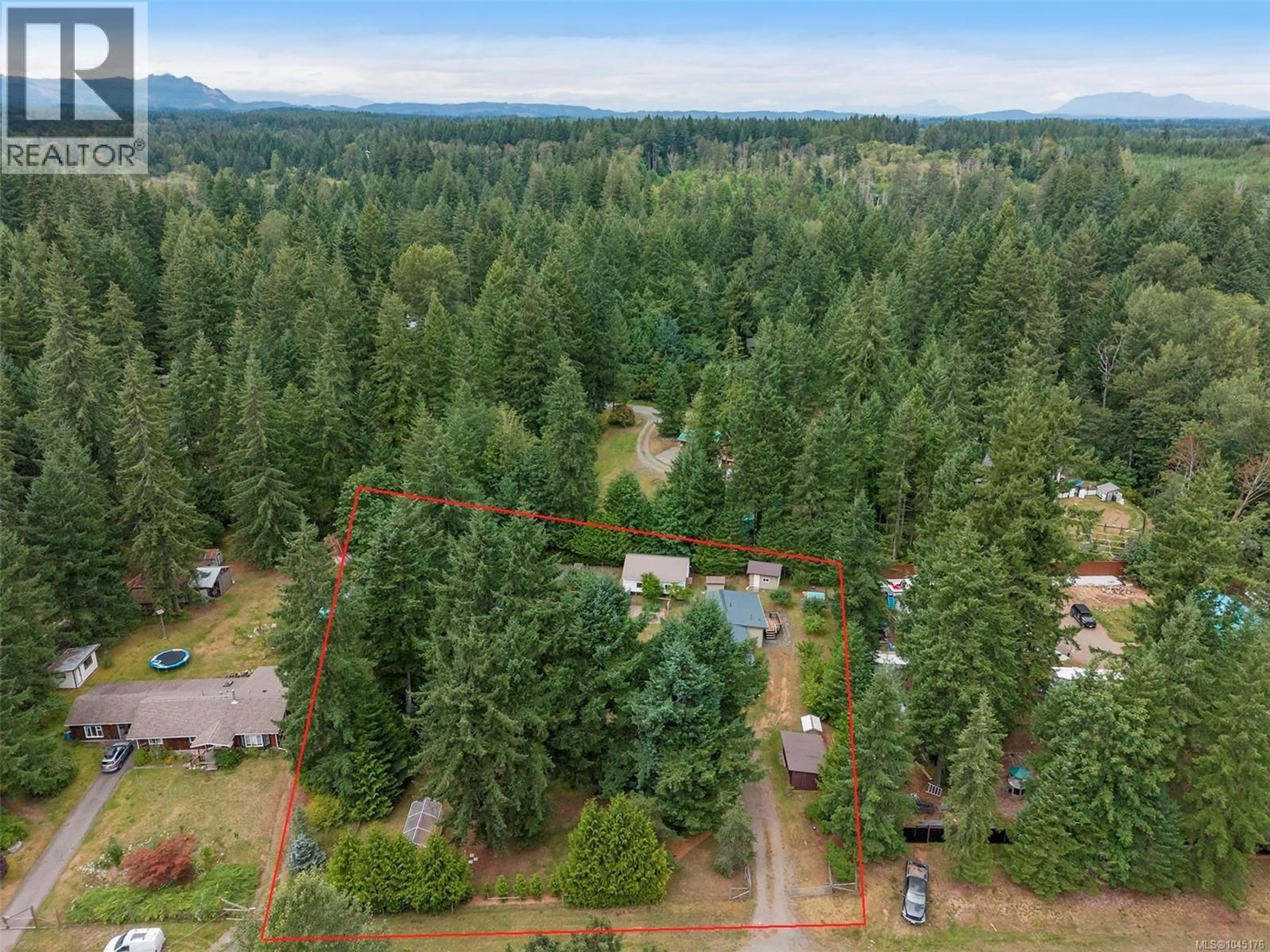 A pic from outside/outdoor area/front of a property/back of a property/a pic from drone, forest/trees view for 3713 JAMES CRESCENT, Black Creek British Columbia V9J1E9