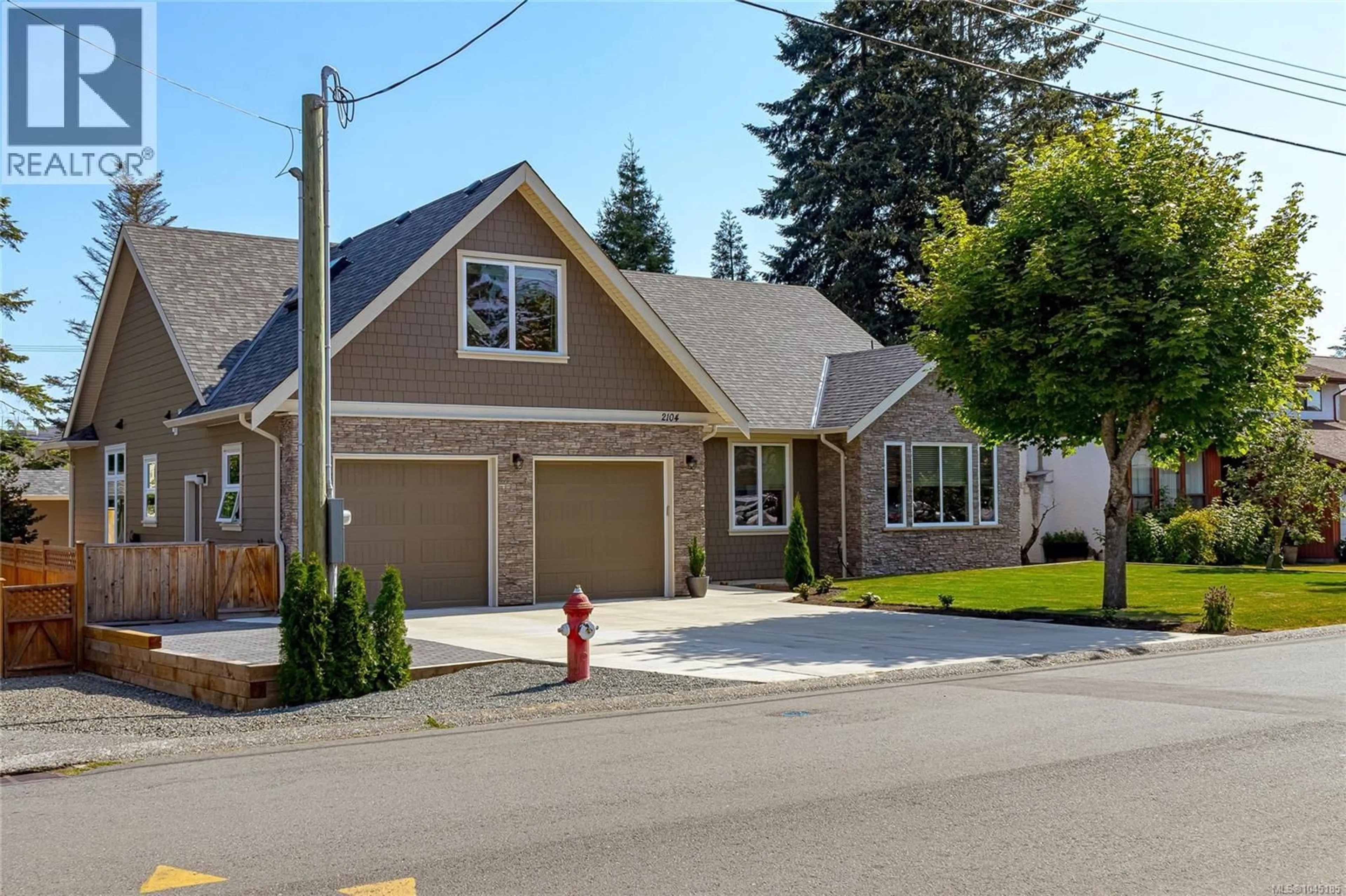 Home with vinyl exterior material, street for 2104 COLINWOOD ROAD, Sidney British Columbia V8L4H5
