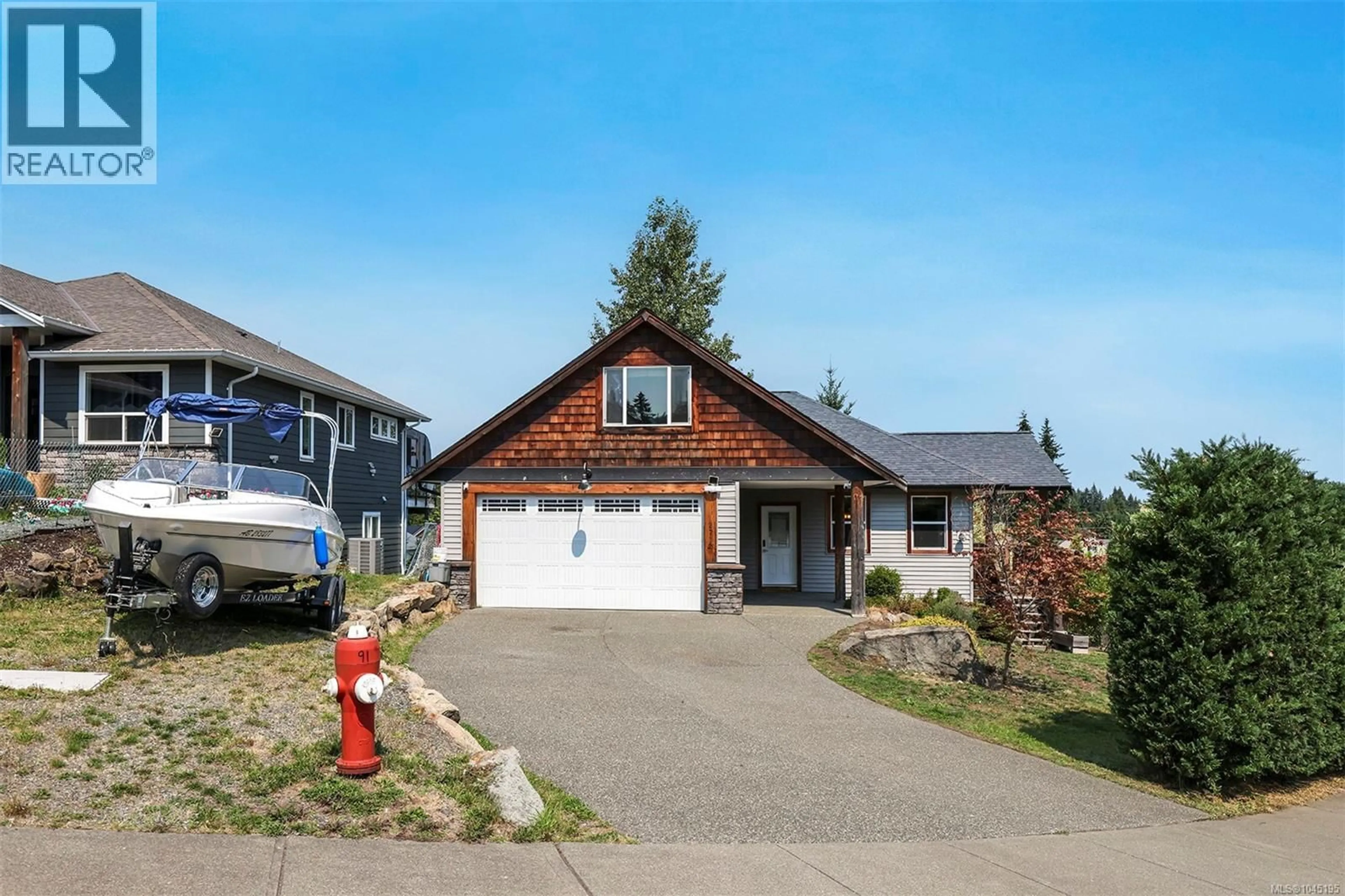 Home with vinyl exterior material, street for 2712 RYDAL AVENUE, Cumberland British Columbia V0R1S0