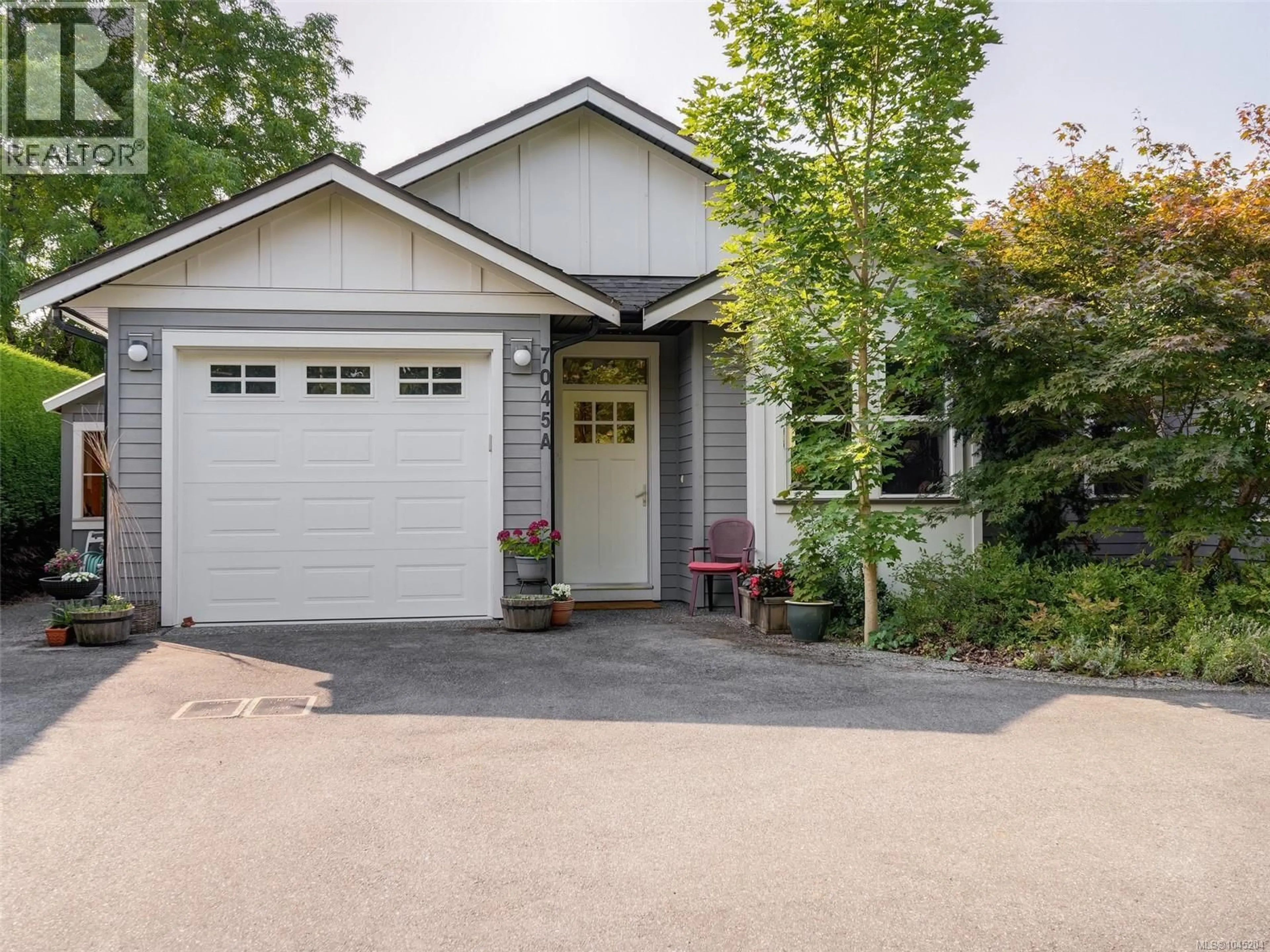 Home with vinyl exterior material, street for A - 7045 WALLACE DRIVE, Central Saanich British Columbia V8M1E9