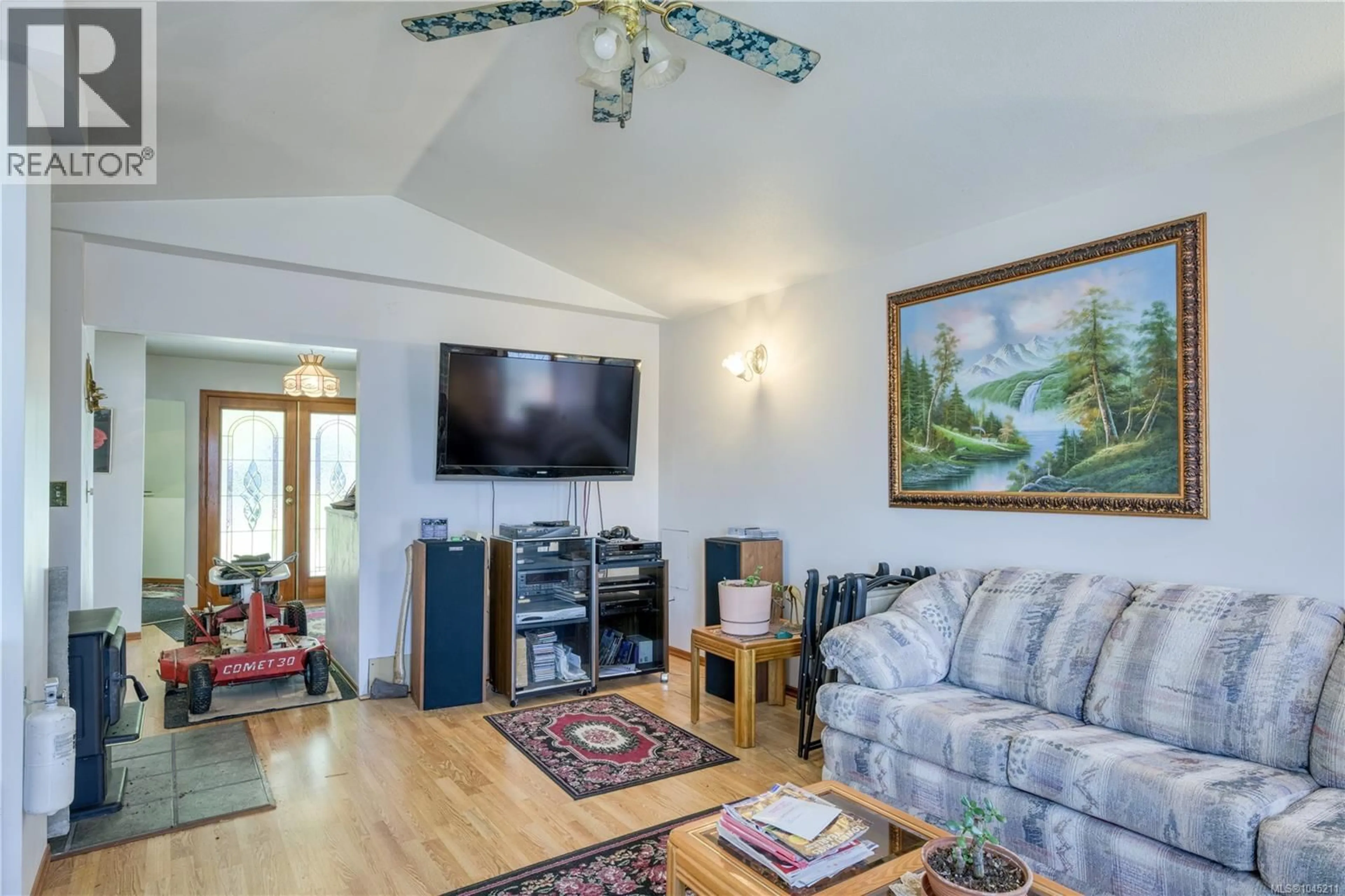 Living room with furniture, wood/laminate floor for 249 HARBOUR ROAD, Coal Harbour British Columbia V0N1K0
