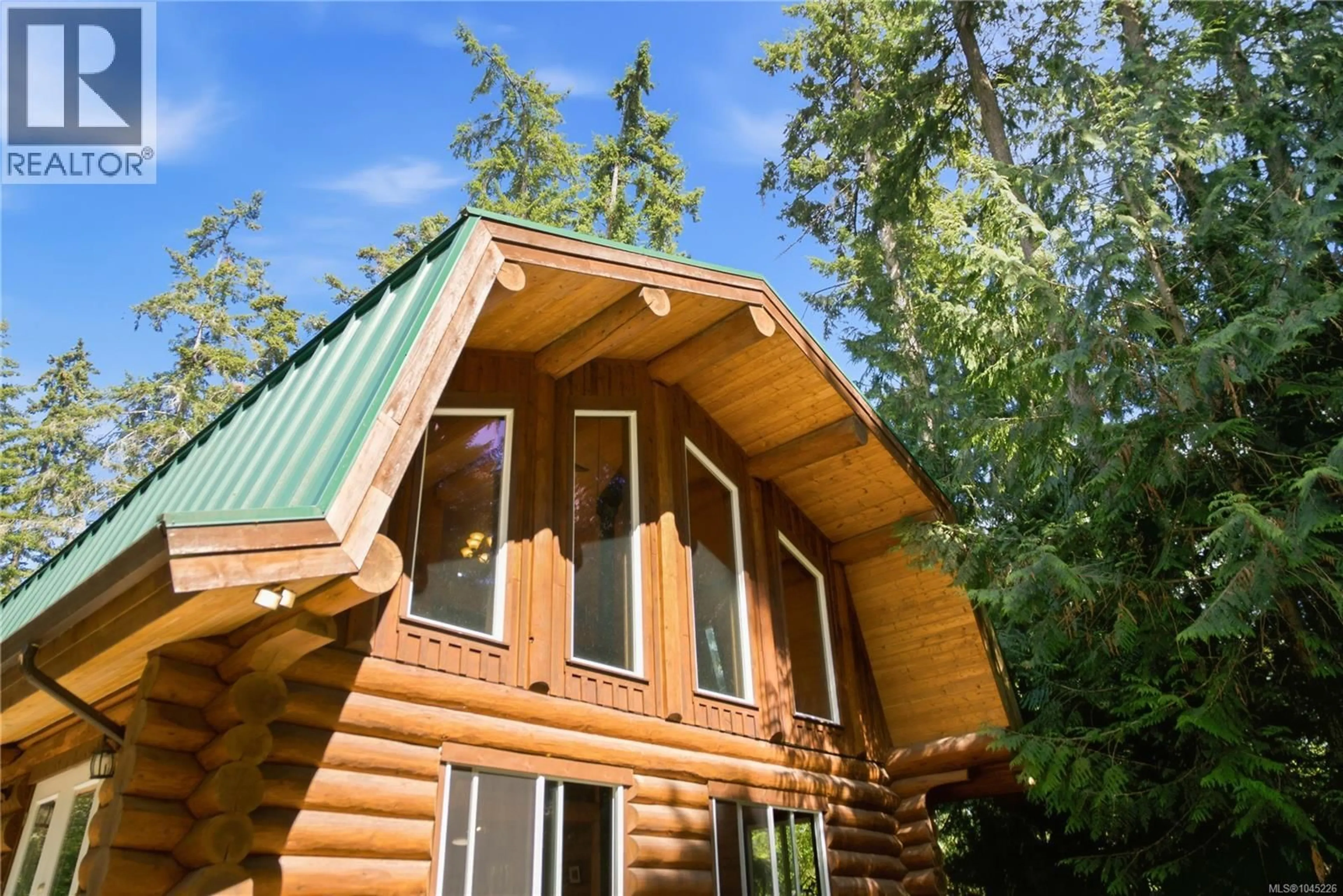 Home with vinyl exterior material, unknown for 700 FERN ROAD EAST, Qualicum Beach British Columbia V9K1M4