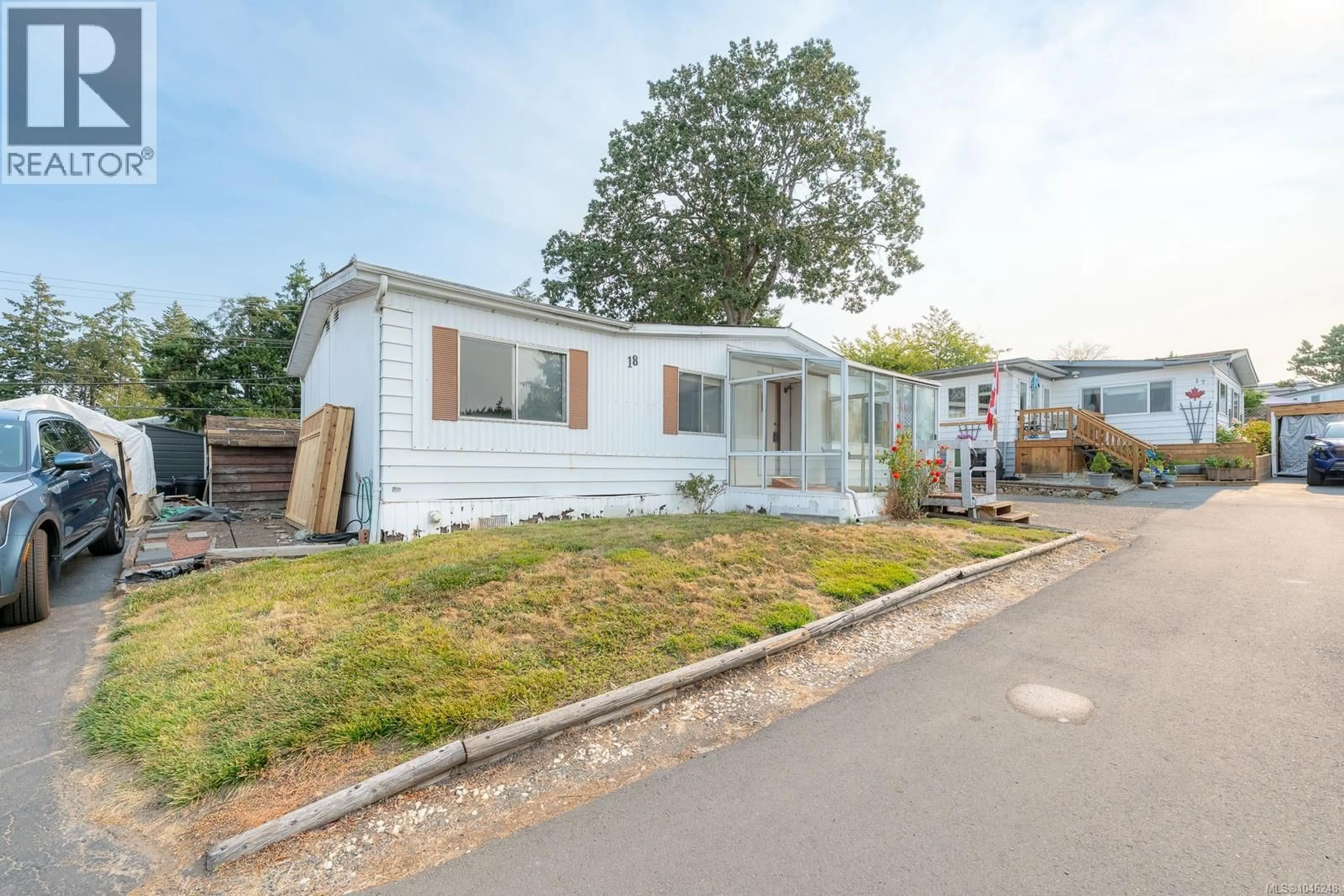 A pic from outside/outdoor area/front of a property/back of a property/a pic from drone, street for 18 - 158 COOPER ROAD, View Royal British Columbia V9A7B3