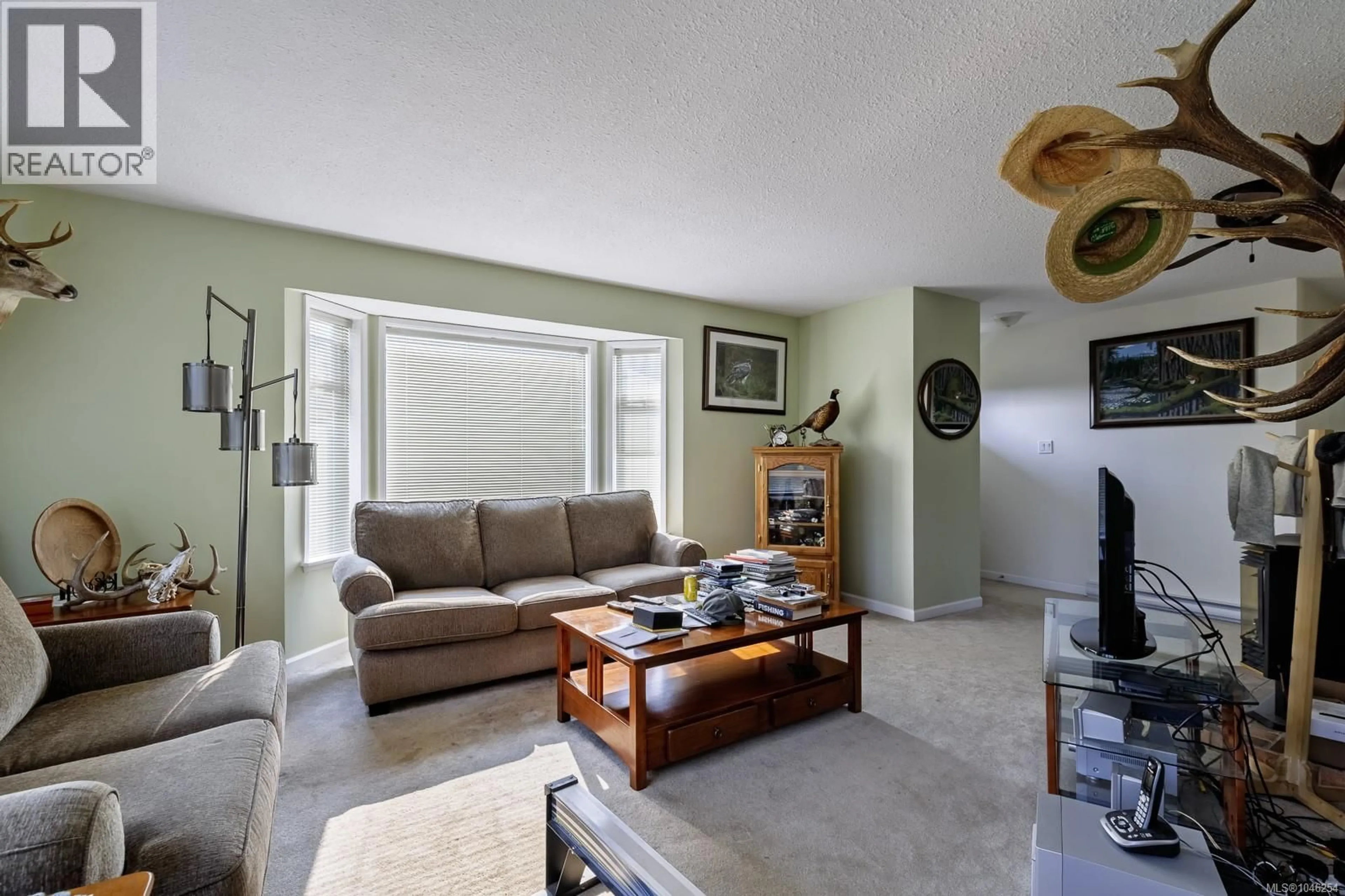 Living room with furniture, unknown for 6789 PHILIP ROAD, Lantzville British Columbia V0R2H0