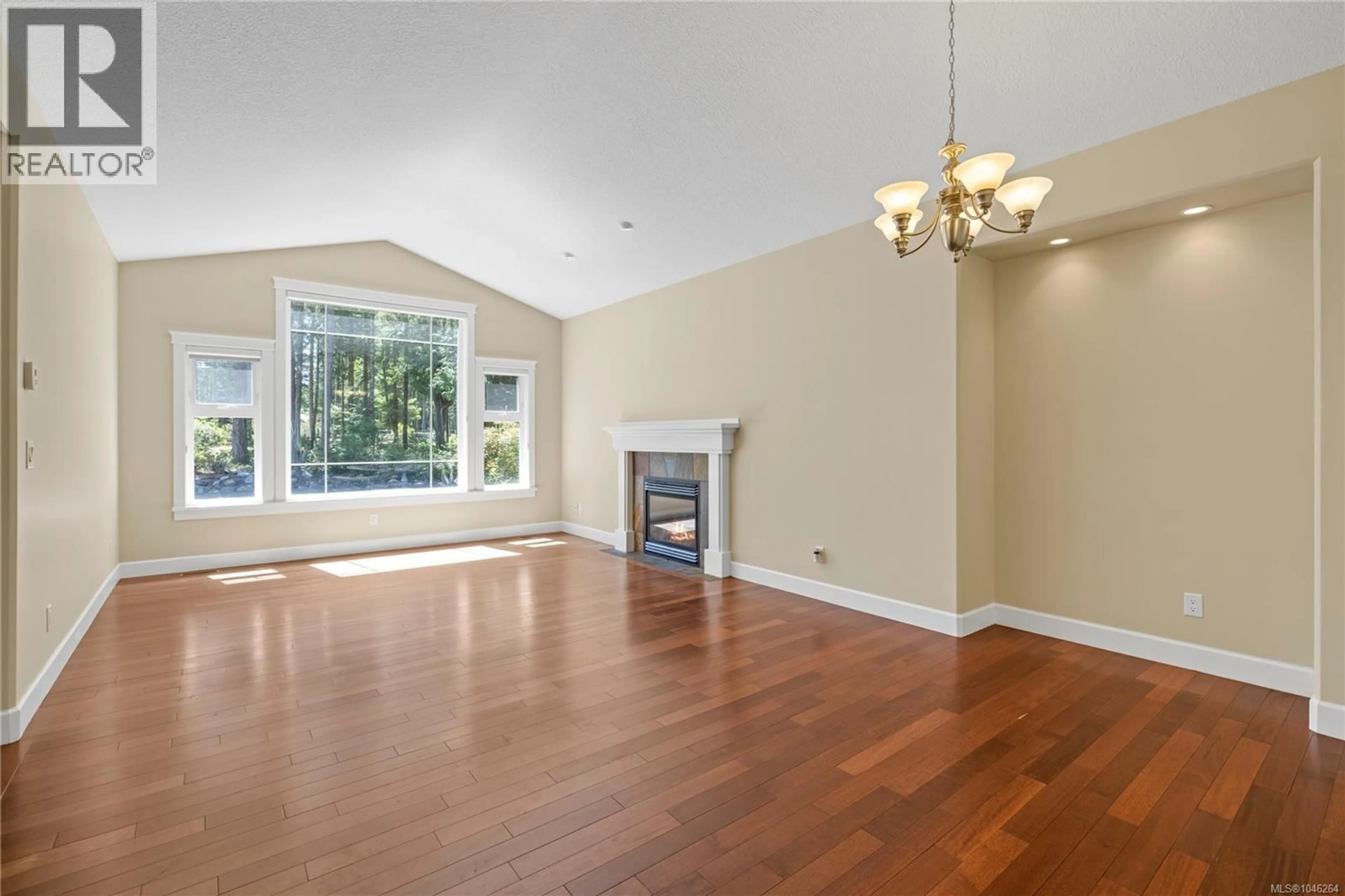 Living room with furniture, wood/laminate floor for 1057 PARADISE PLACE, Nanoose Bay British Columbia V9P9A4